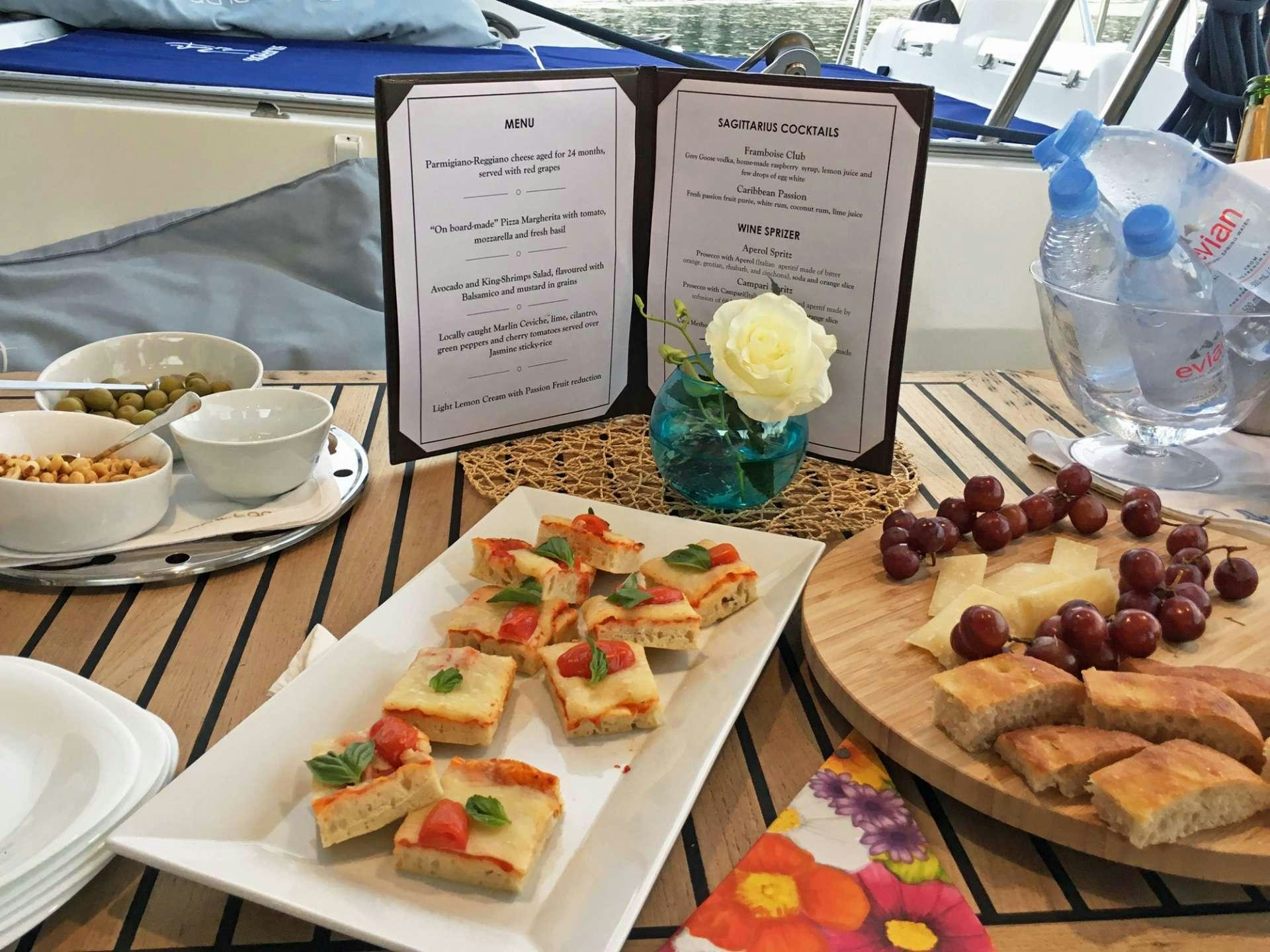 a table full of food aboard SAGITTARIUS Yacht for Charter