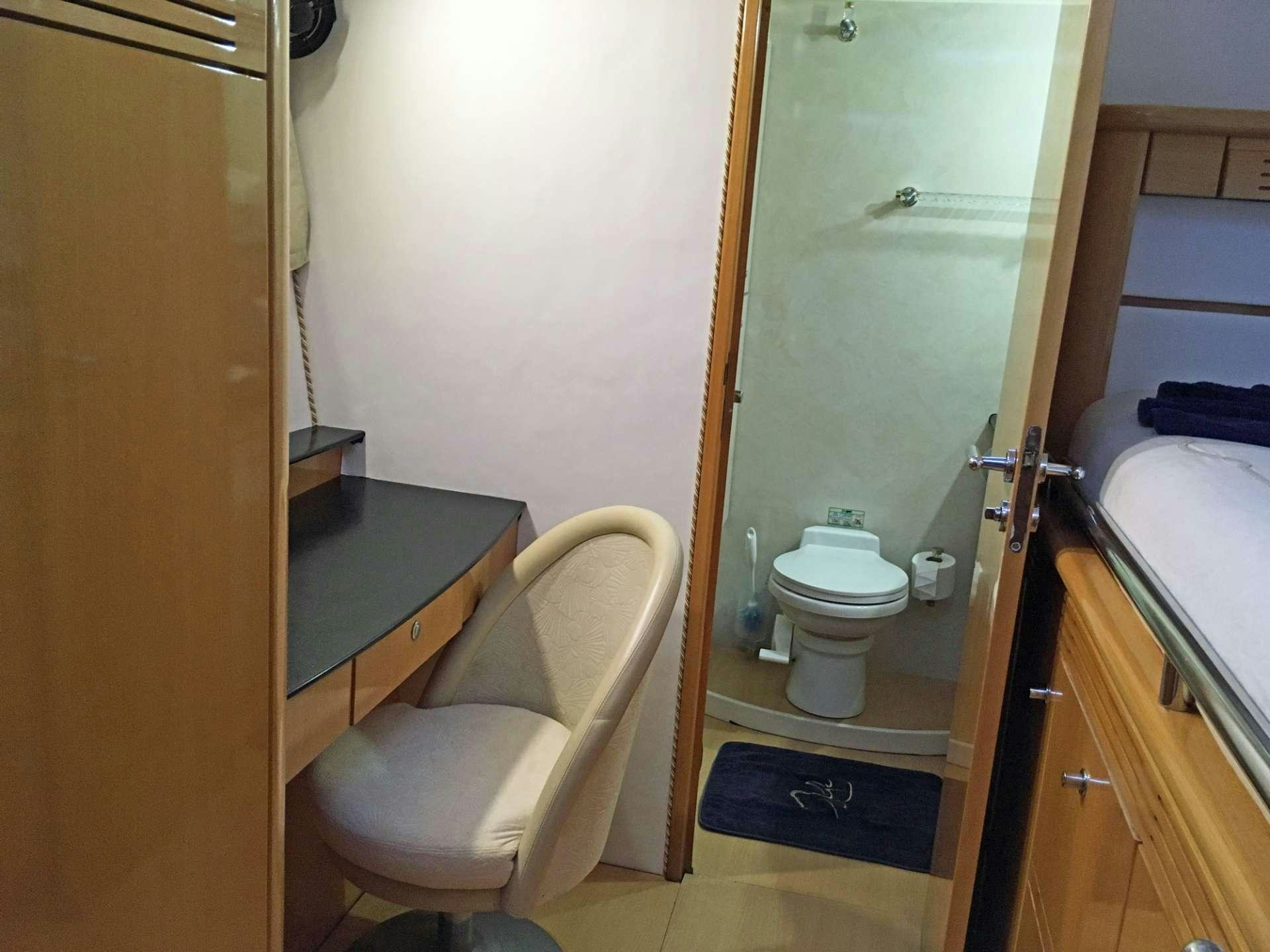 a bathroom with a toilet and a sink aboard SAGITTARIUS Yacht for Charter