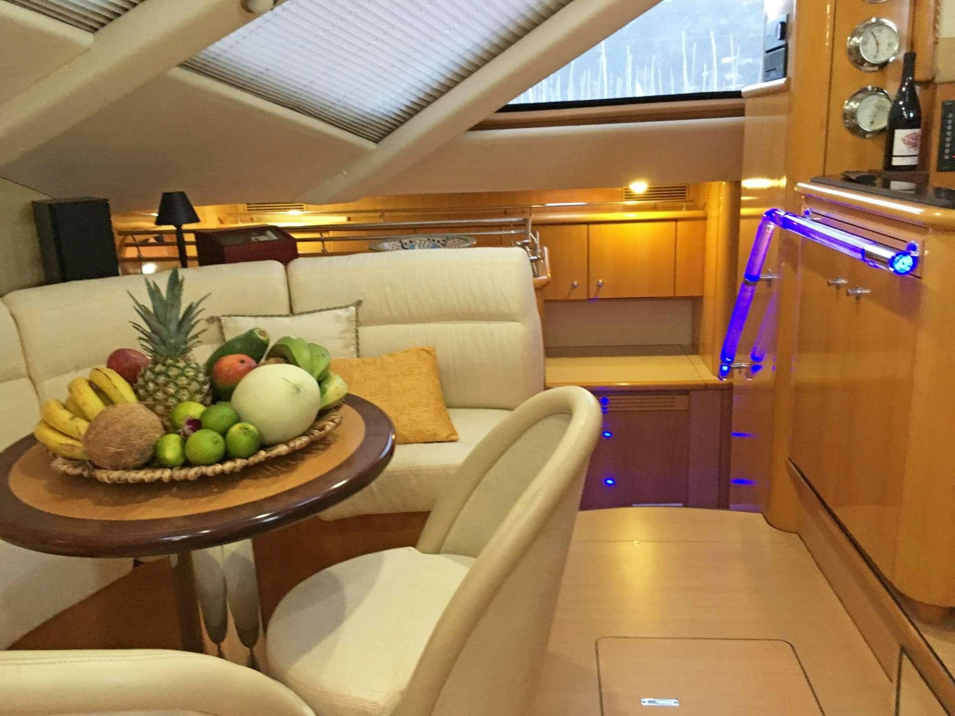 a table with fruit on it aboard SAGITTARIUS Yacht for Charter