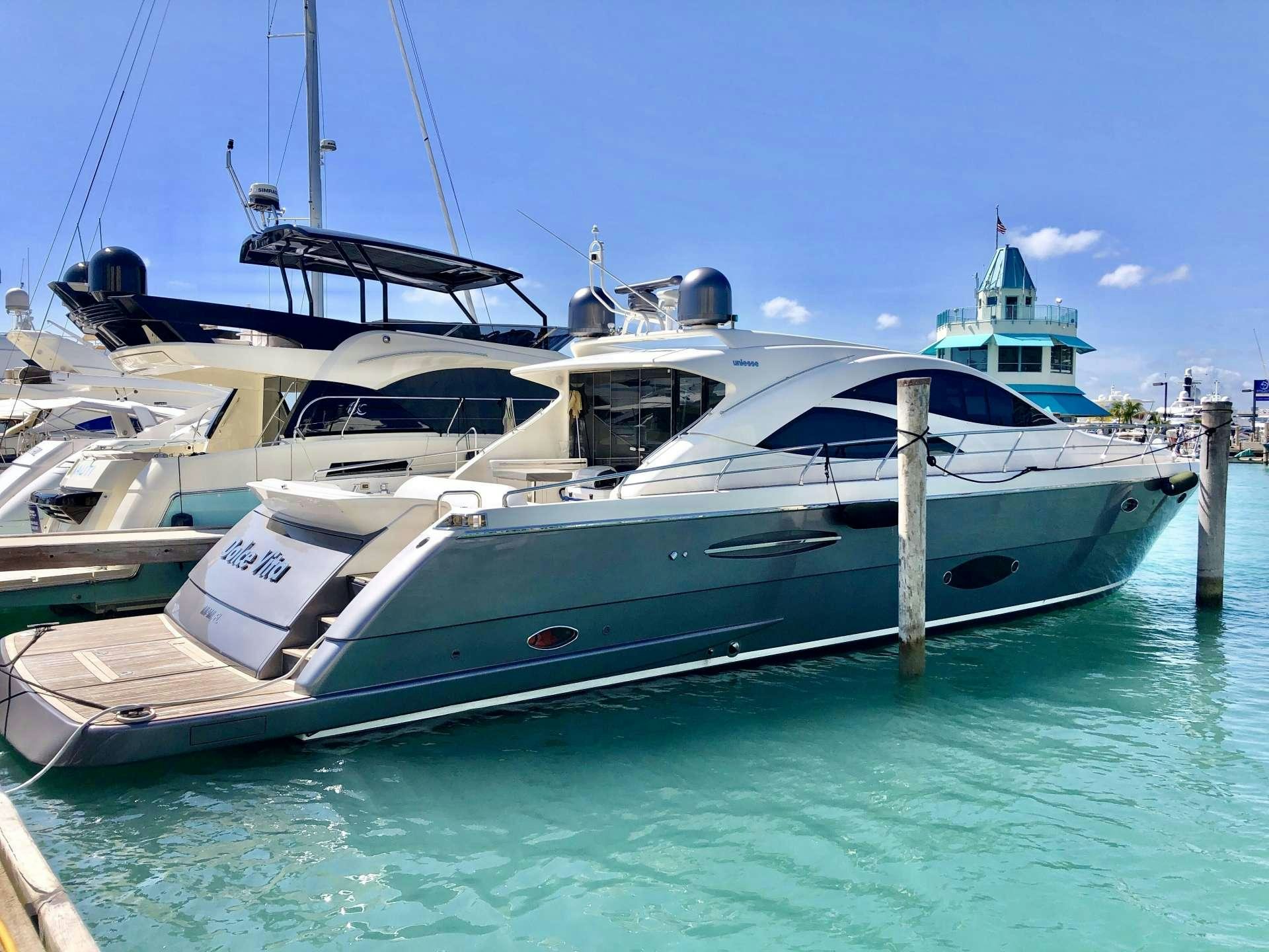 a boat docked at a pier aboard DOLCE VITA Yacht for Charter