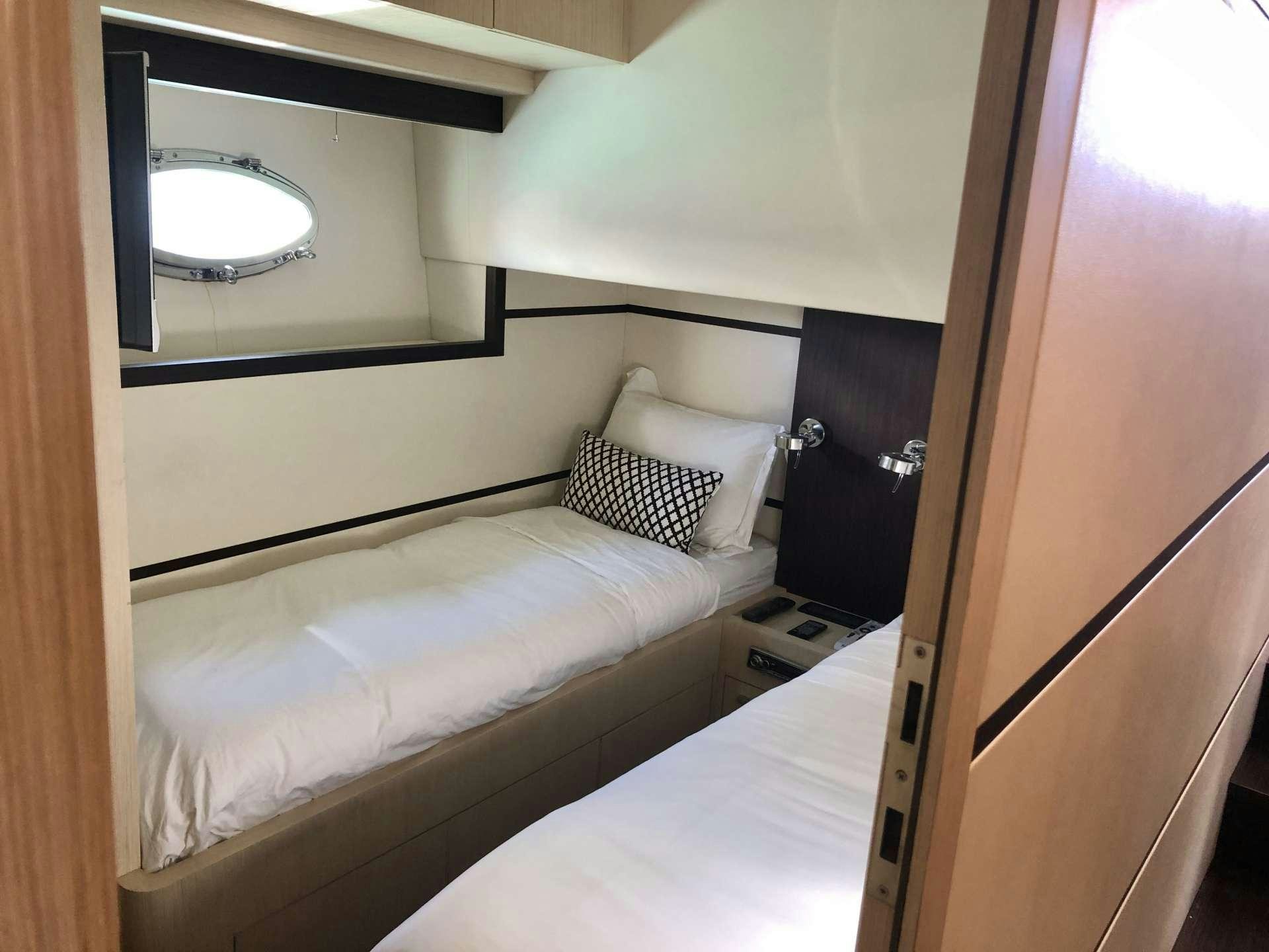 a couple of beds in a room aboard DOLCE VITA Yacht for Charter