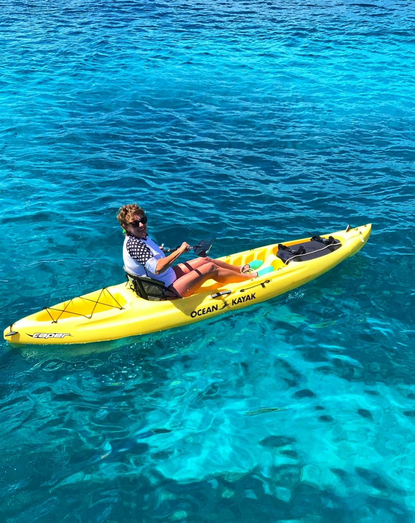 a person in a kayak aboard STARFISH Yacht for Charter