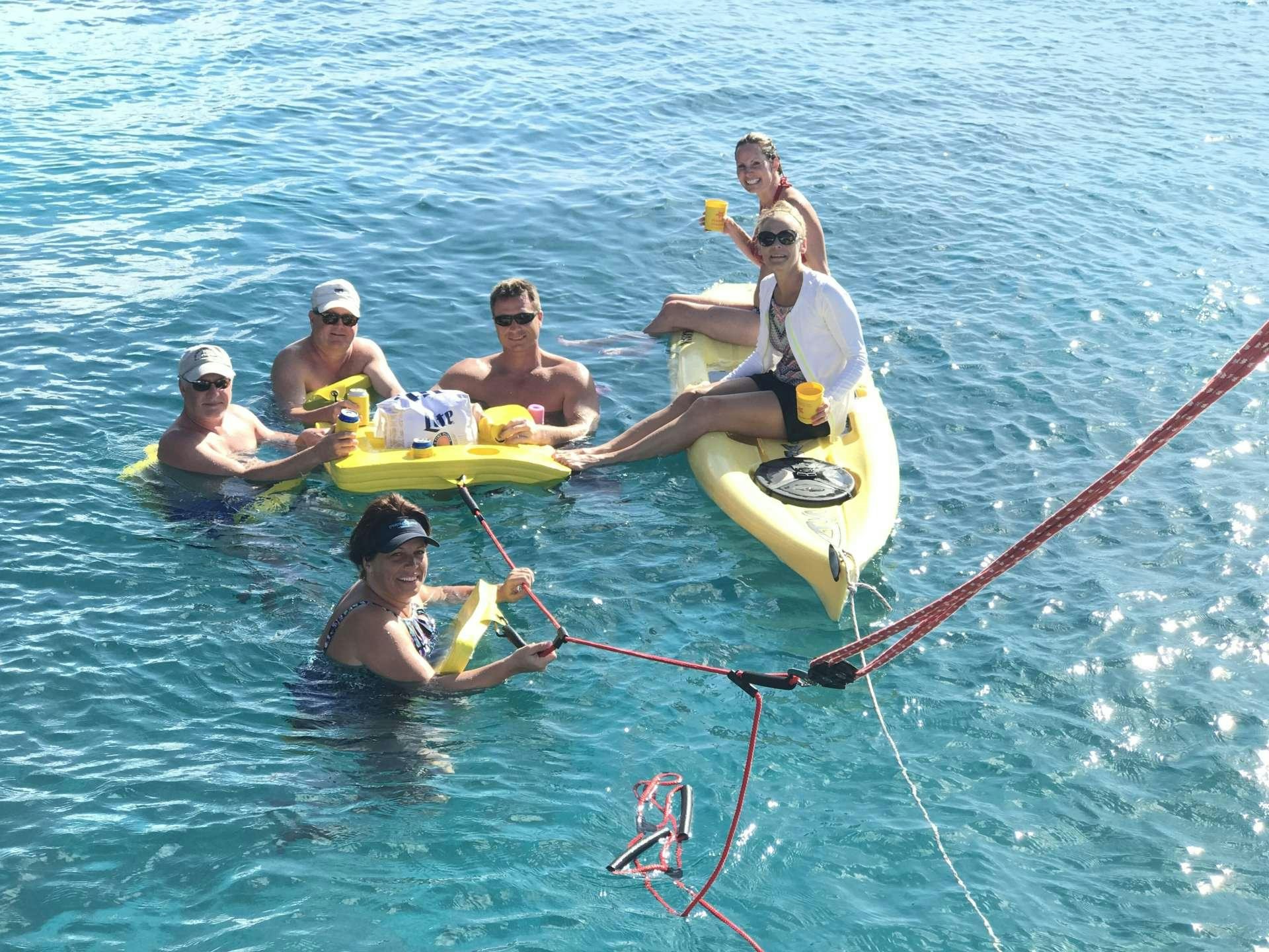 a group of people in a canoe aboard STARFISH Yacht for Charter