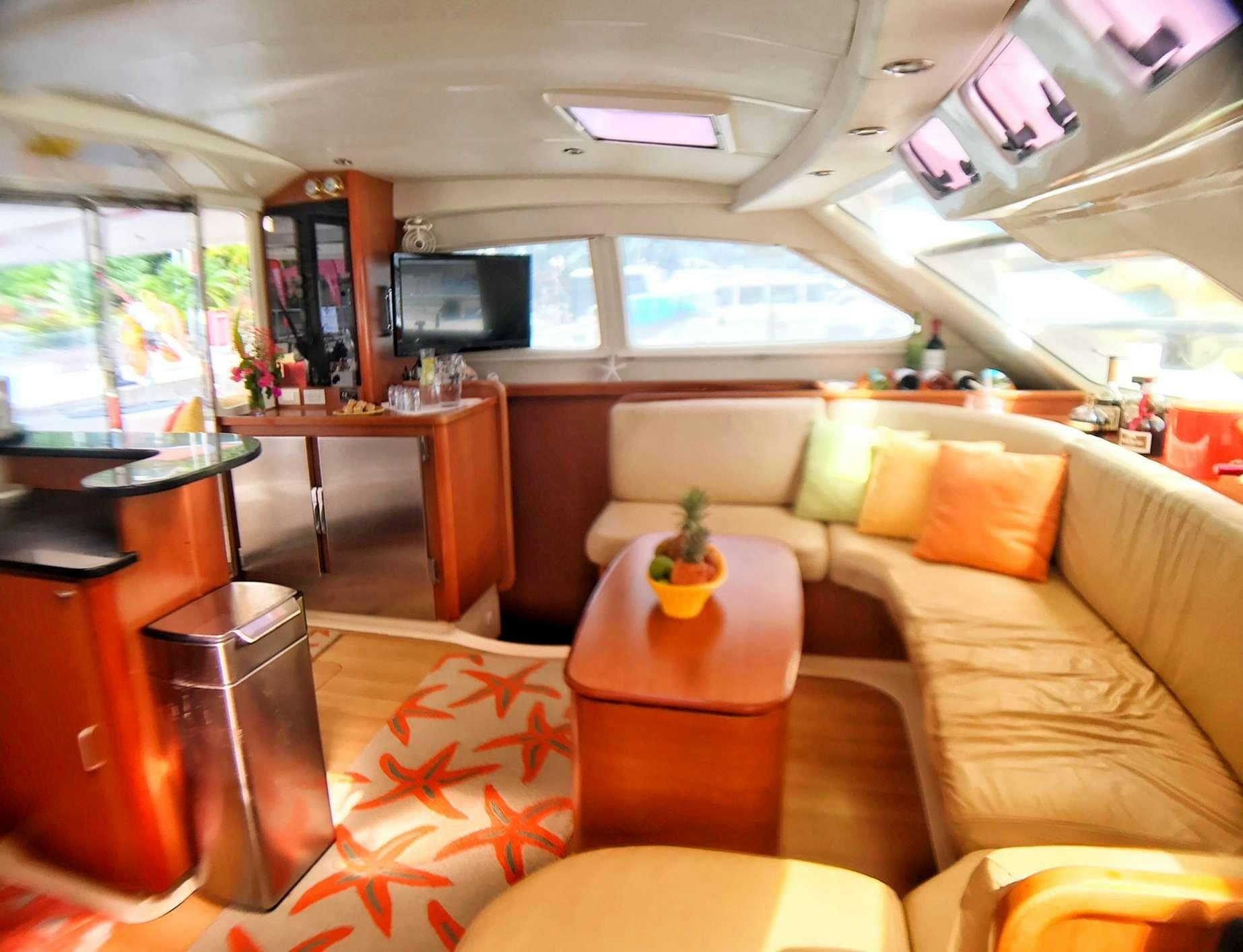 a living room with a couch and a coffee table aboard STARFISH Yacht for Charter