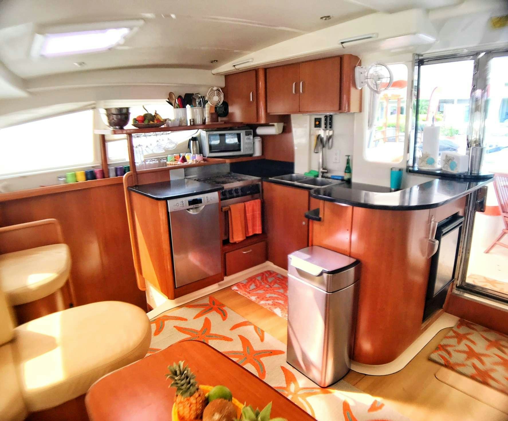 a kitchen with a large island aboard STARFISH Yacht for Charter