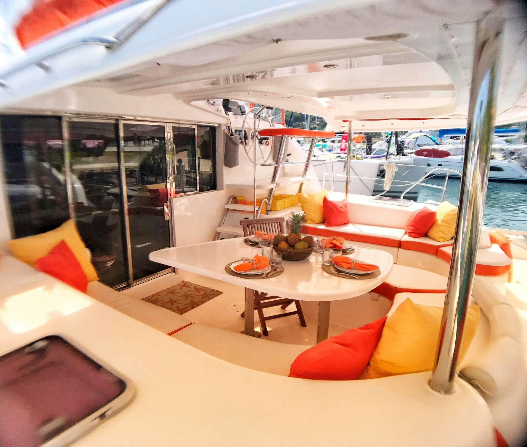 a boat with a table and chairs aboard STARFISH Yacht for Charter