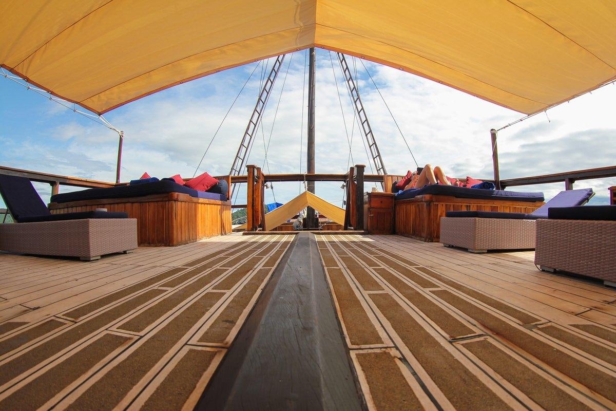 a large tent with a large metal arch over a road aboard DAMAI Yacht for Charter