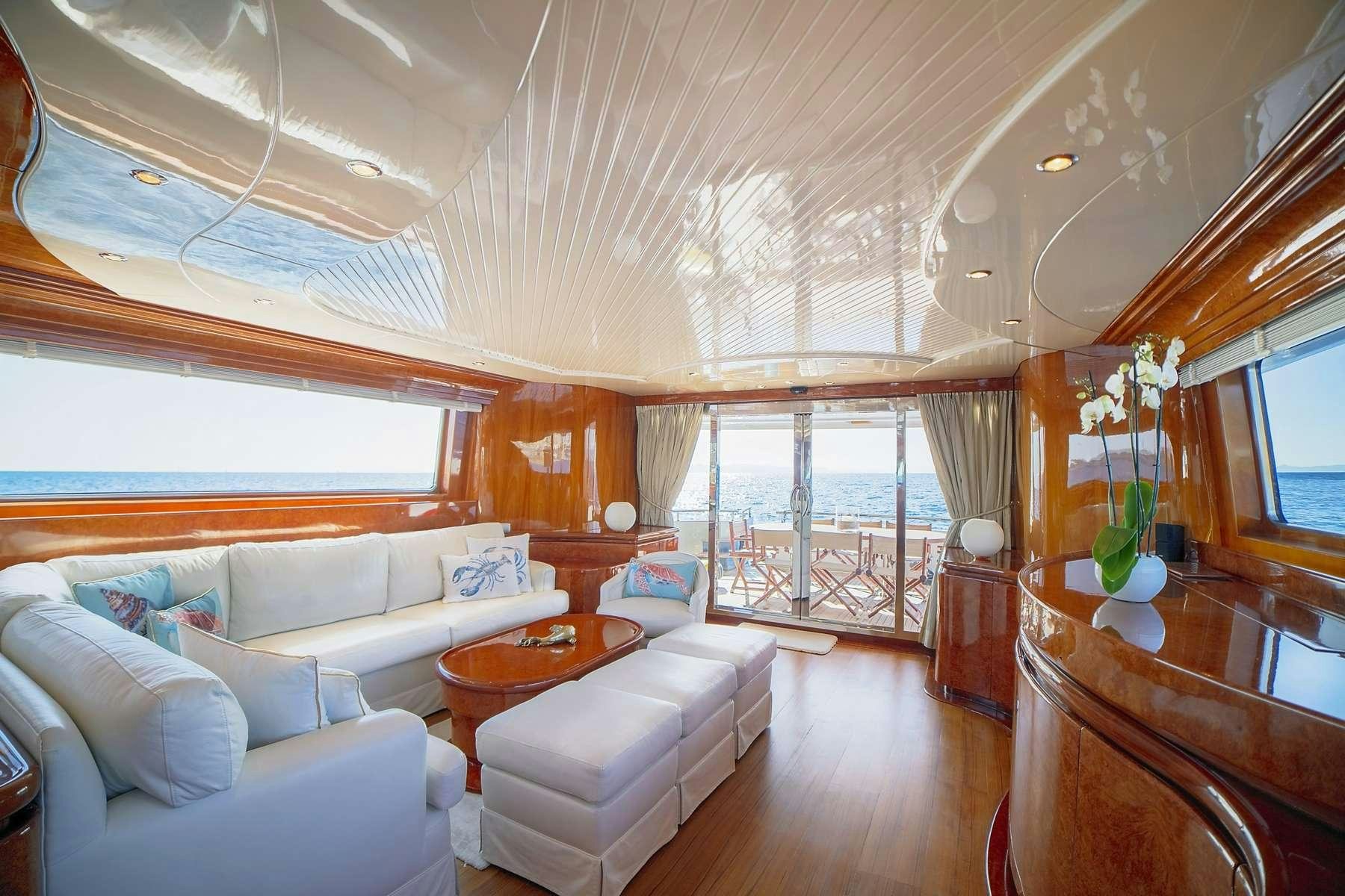 a large living room with a large window aboard ZOI Yacht for Charter