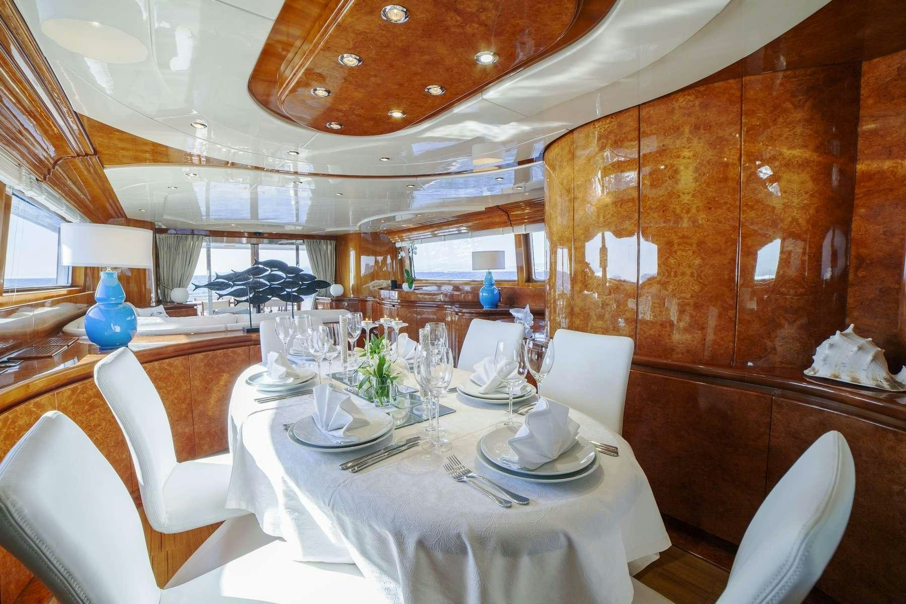 a dining room with a table set aboard ZOI Yacht for Charter
