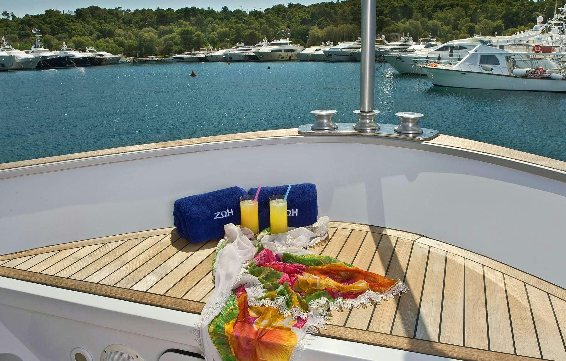 a picnic table on a boat aboard ZOI Yacht for Charter