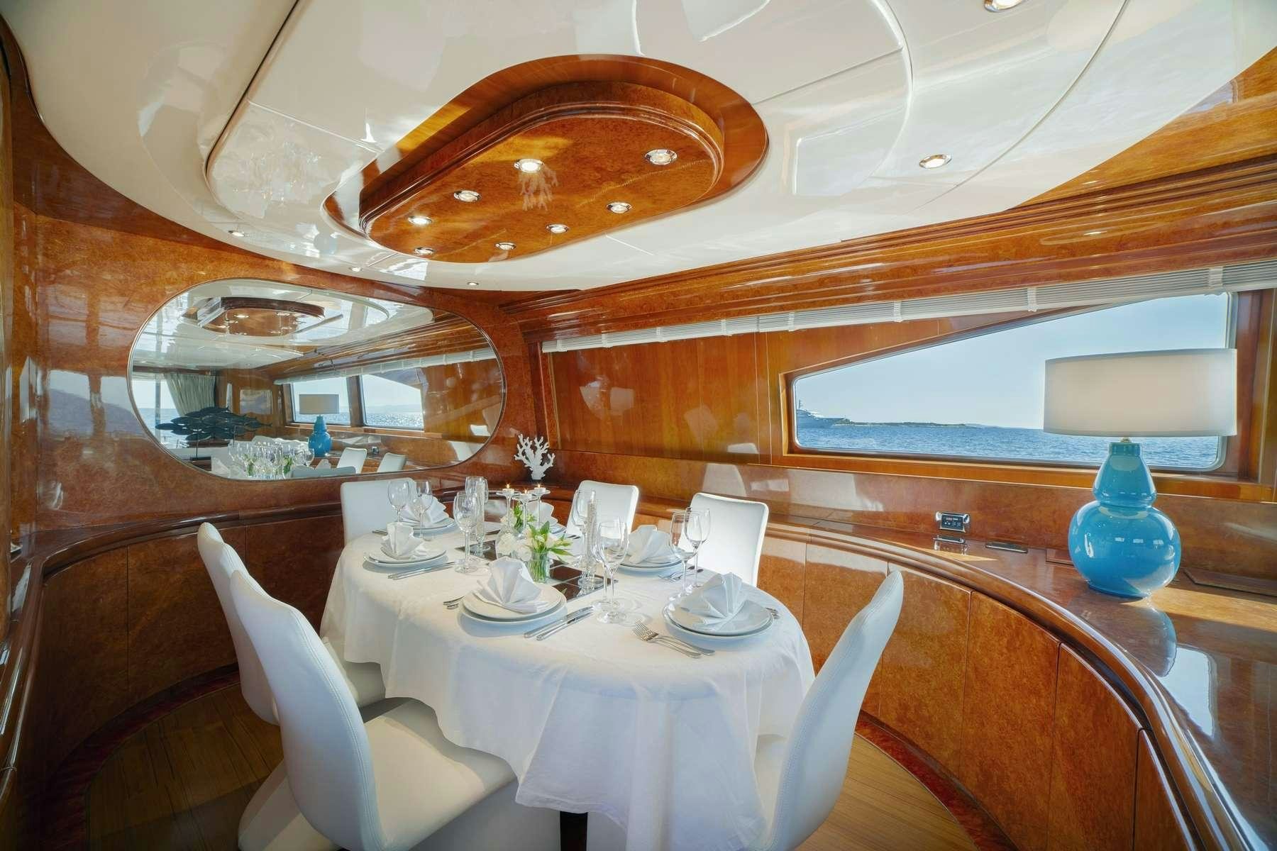 a dining room with a table set aboard ZOI Yacht for Charter