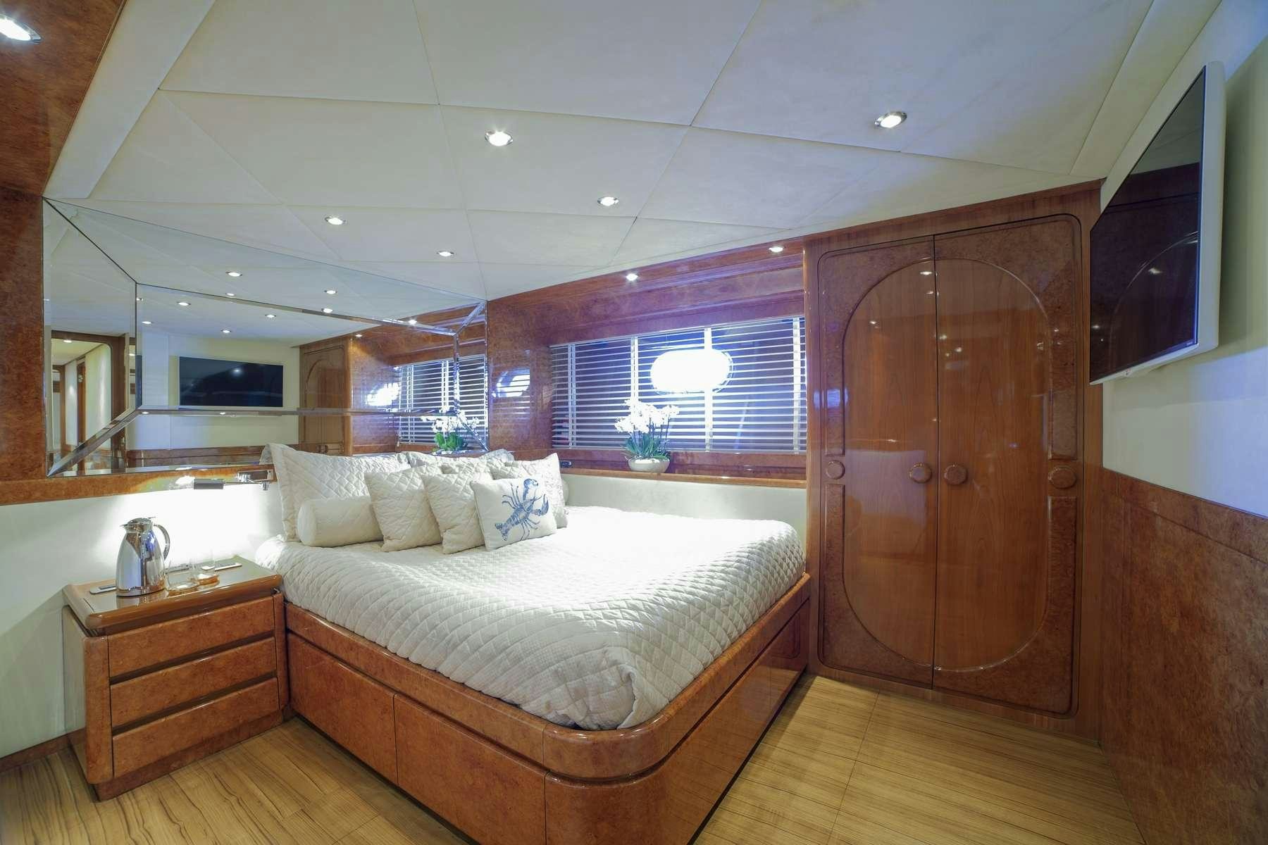 a bed in a room aboard ZOI Yacht for Charter