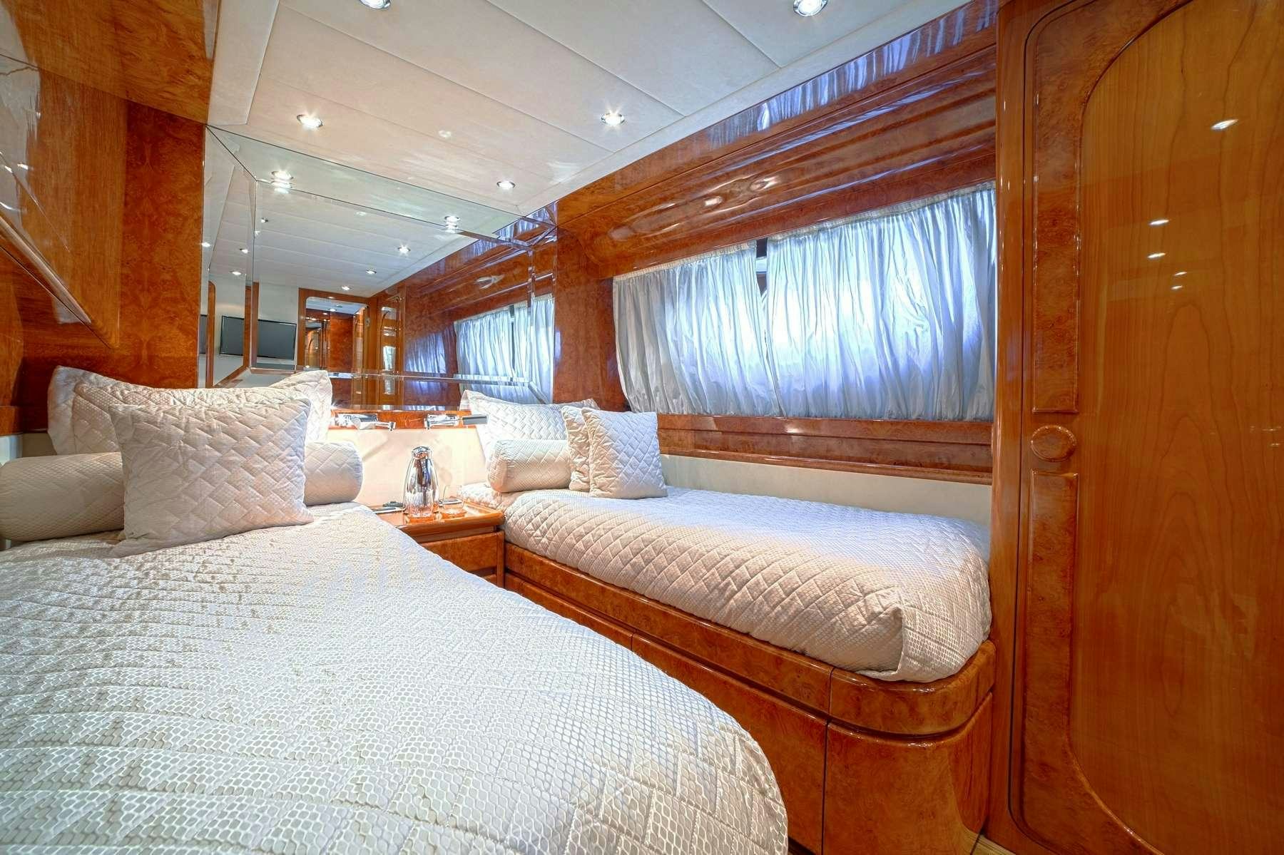 a room with two beds aboard ZOI Yacht for Charter