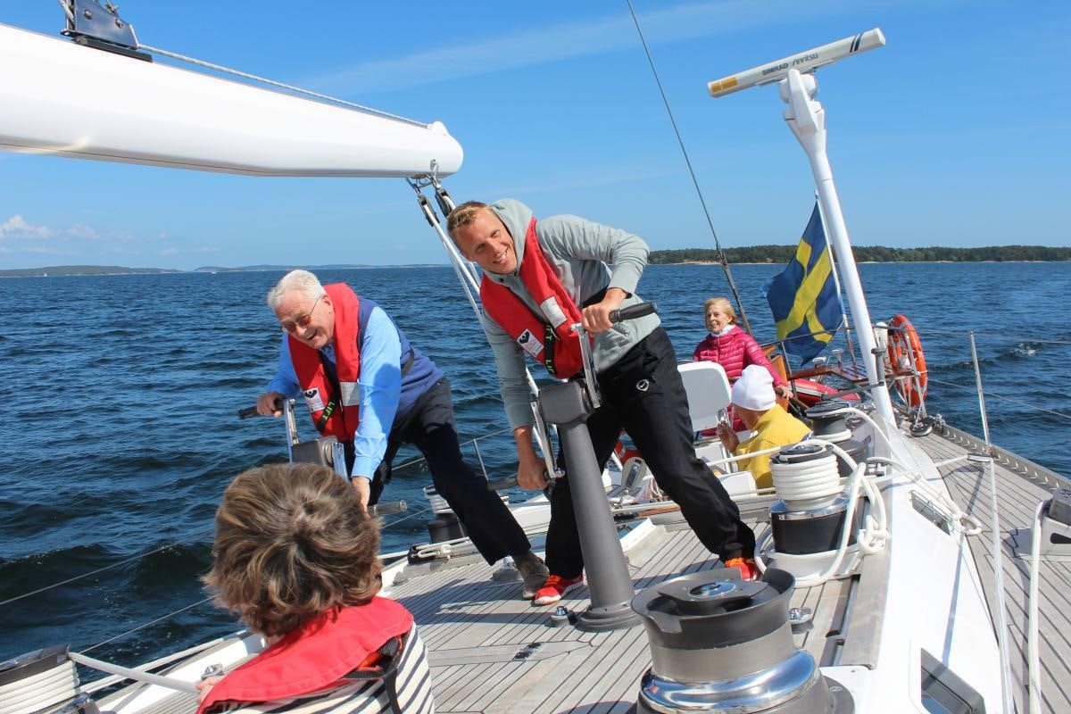 a group of people on a boat aboard ICHIBAN Yacht for Charter