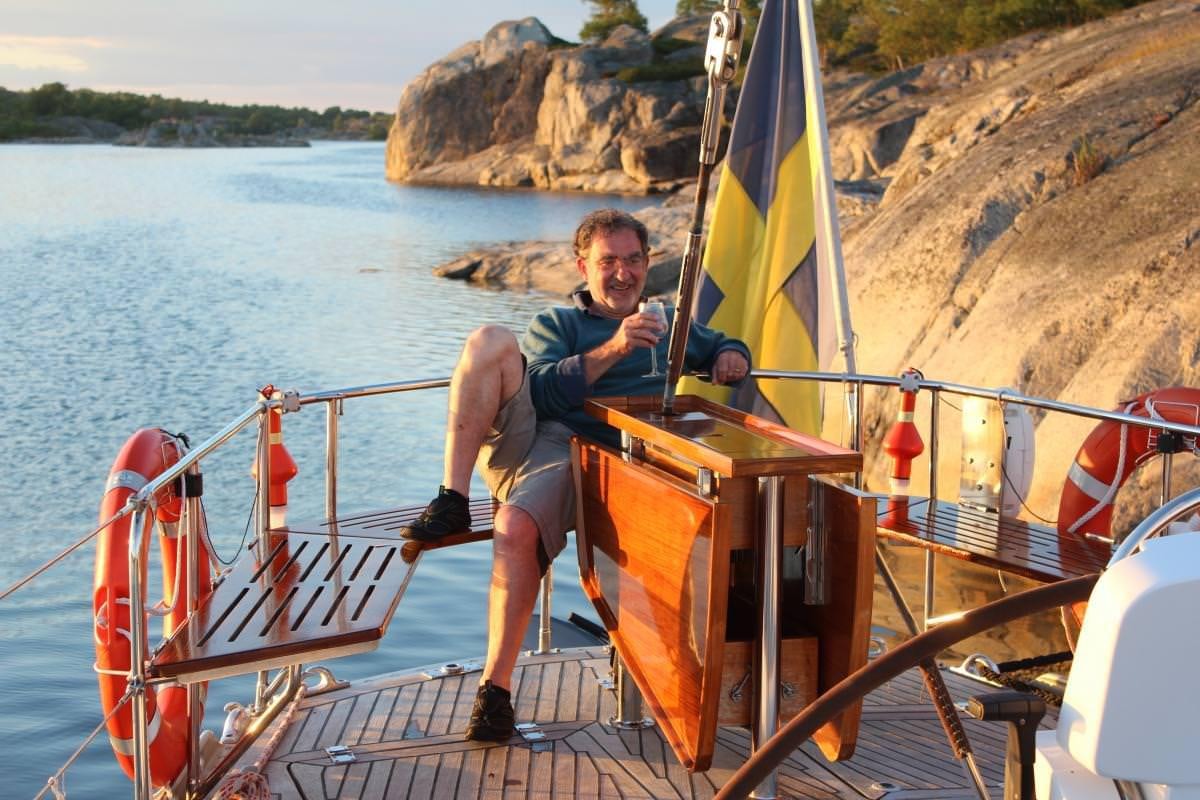 a man sitting on a boat aboard ICHIBAN Yacht for Charter