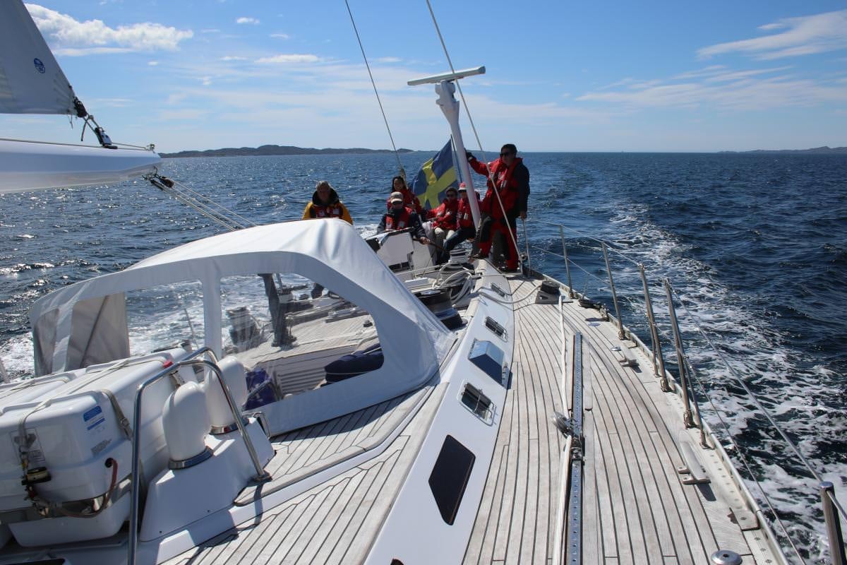 a group of people on a boat aboard ICHIBAN Yacht for Charter