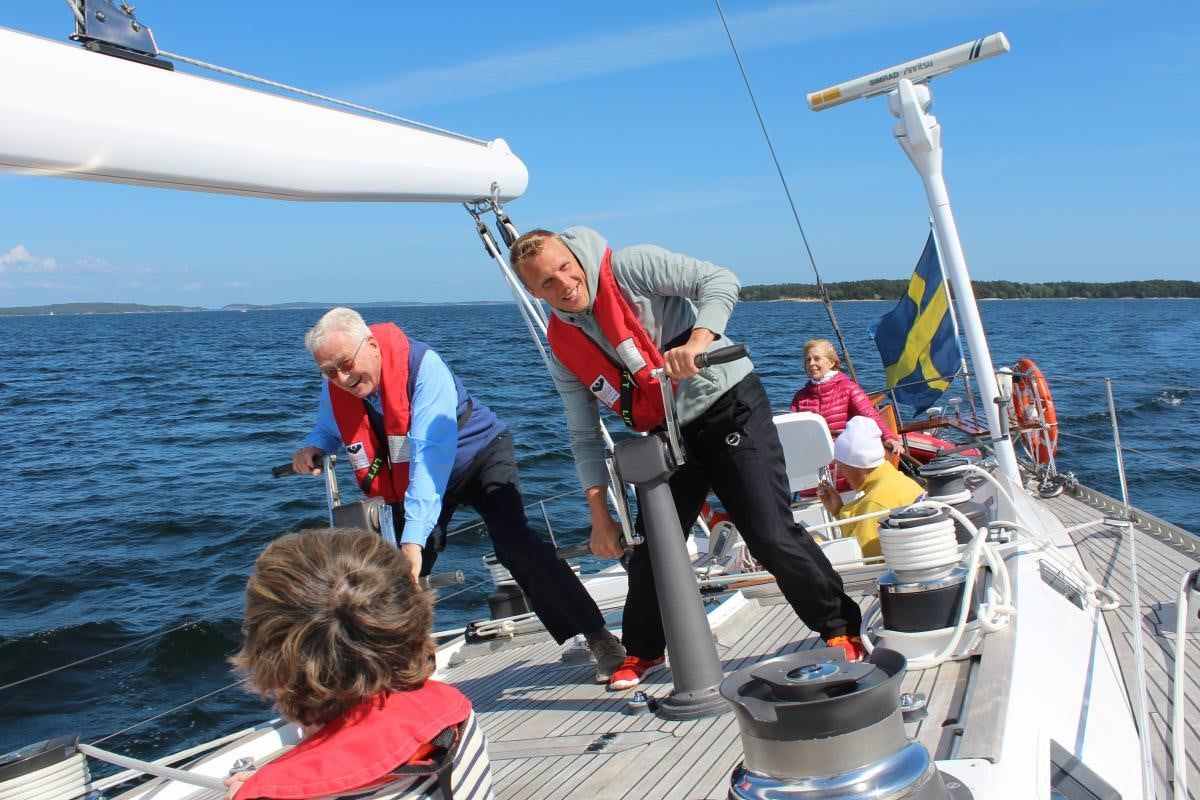 a group of people on a boat aboard ICHIBAN Yacht for Charter