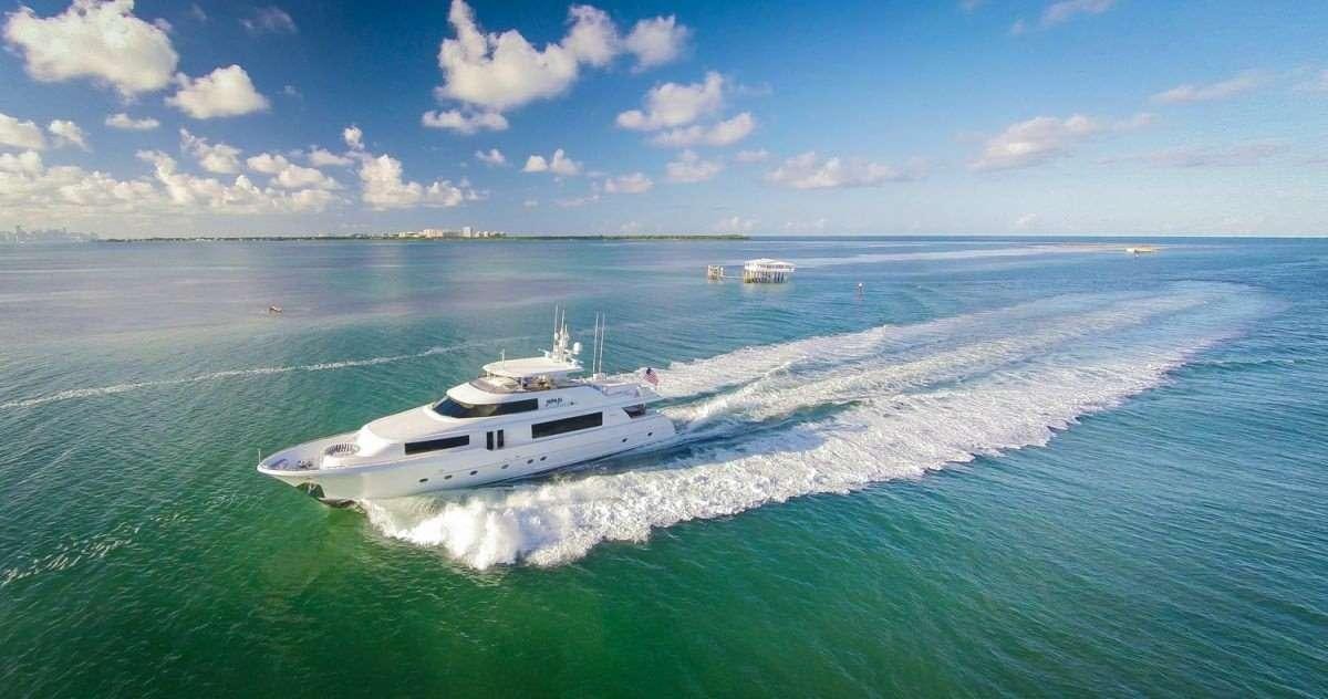 a white yacht on the water aboard NAUTI N' Yacht for Charter