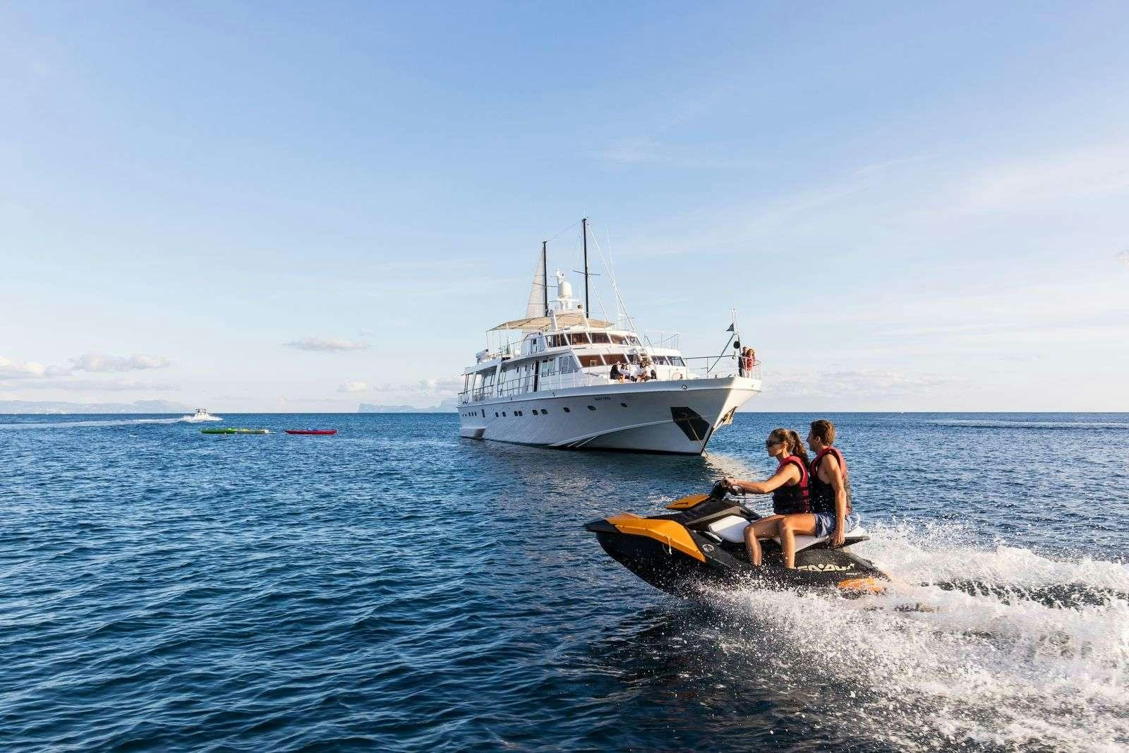 a couple people on a boat in the water aboard Nafisa Yacht for Charter