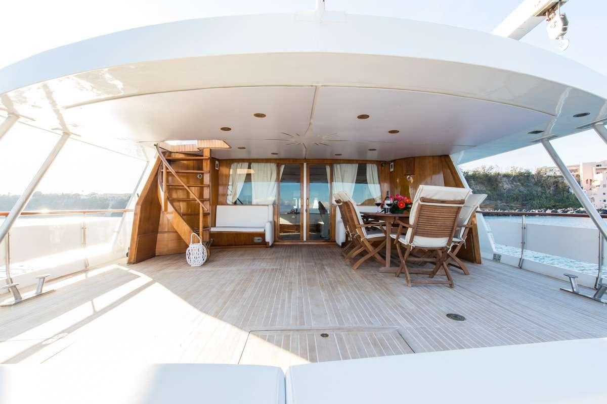 a large open house with a large deck and a pool aboard Nafisa Yacht for Charter