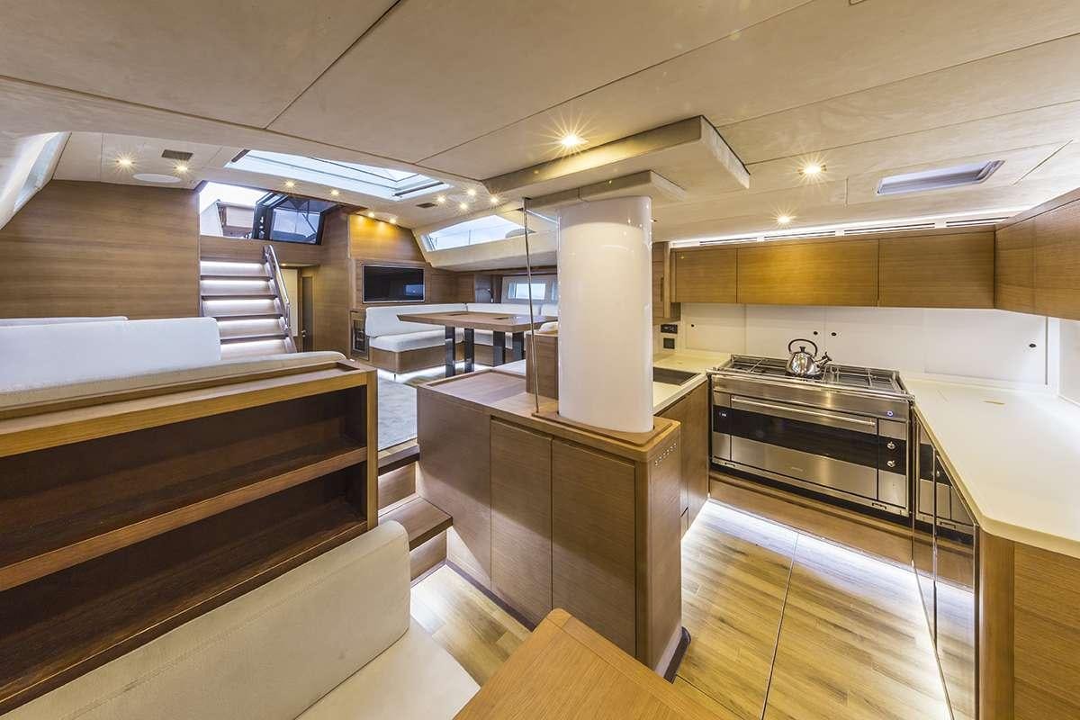 a kitchen with a large island aboard JIKAN Yacht for Charter