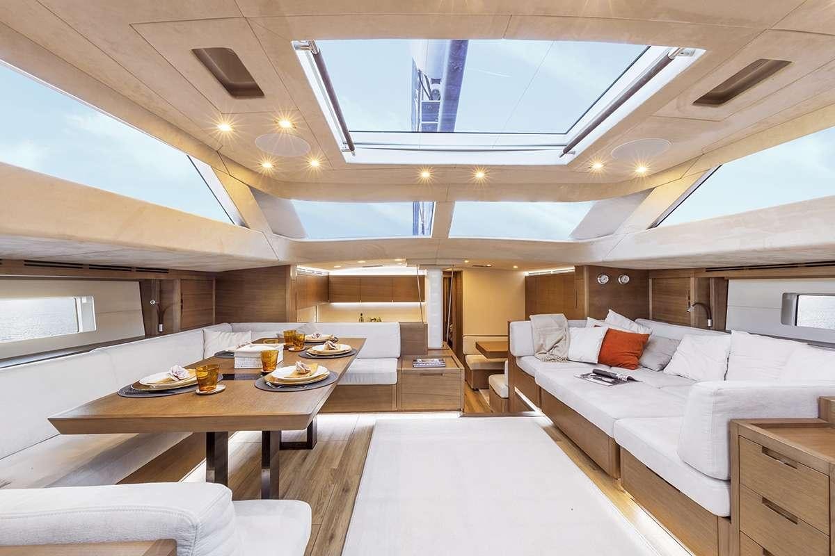 a room with a bed and a table aboard JIKAN Yacht for Charter