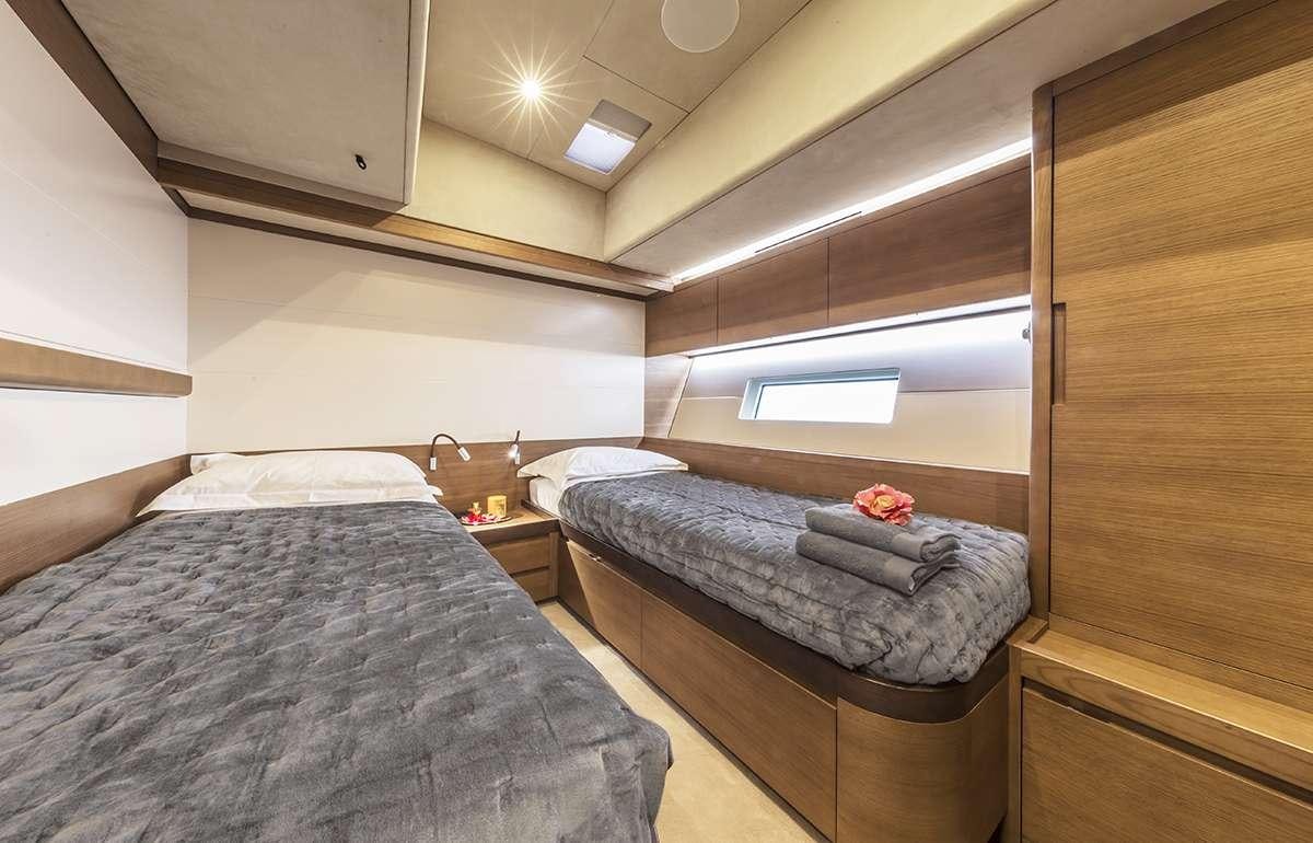 a room with two beds aboard JIKAN Yacht for Charter
