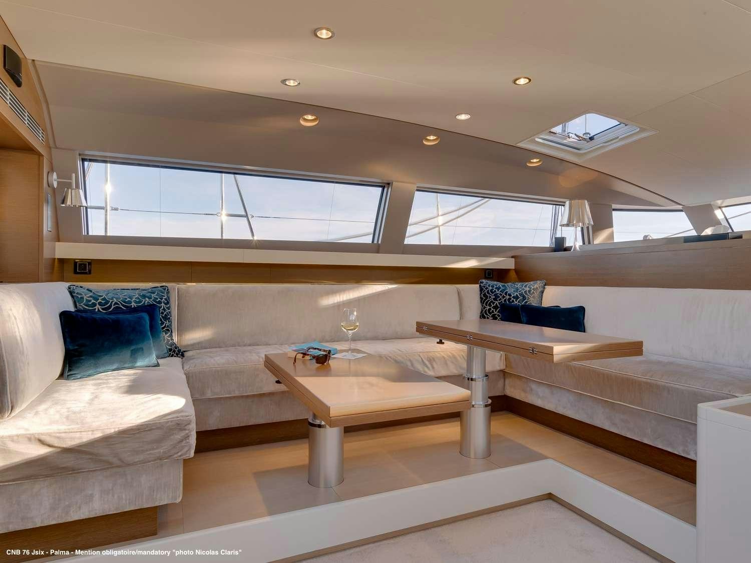 a modern looking living room aboard J SIX Yacht for Charter
