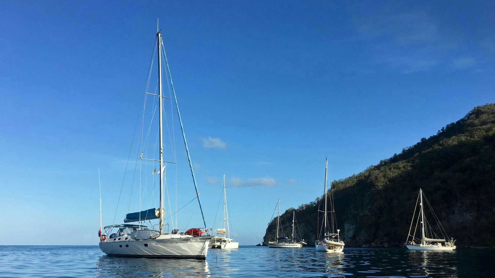 a group of boats in a harbor aboard NEMO SY Yacht for Charter
