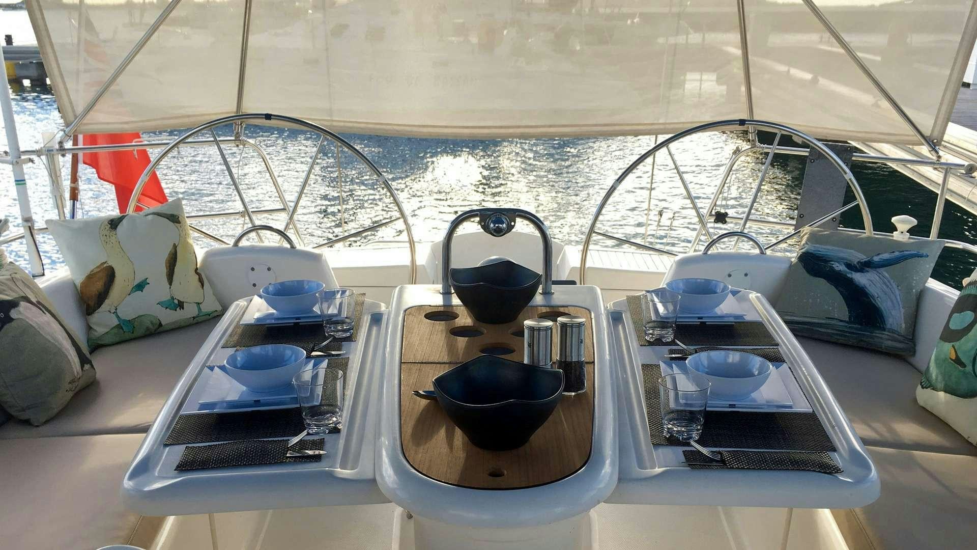 a boat with a glass window and a bowl of food on it aboard NEMO SY Yacht for Charter