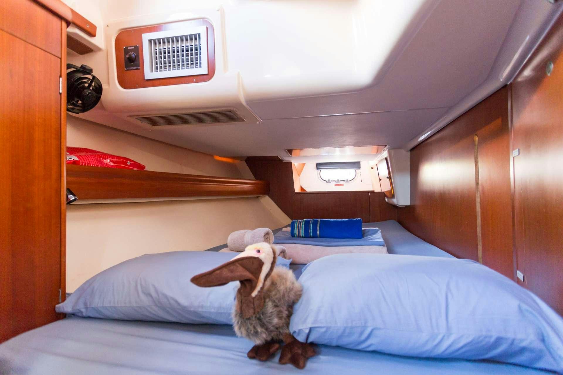 a stuffed toy on a bed aboard NEMO SY Yacht for Charter