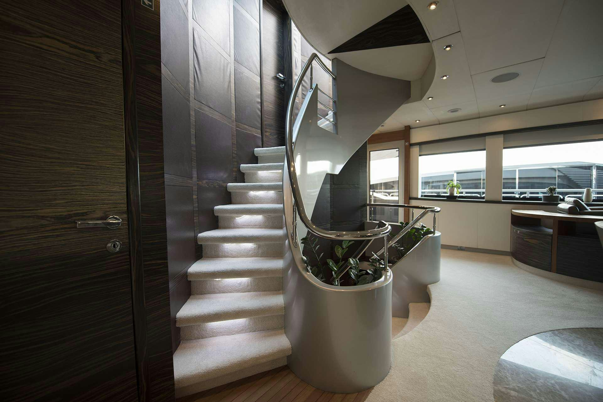 a staircase in a house aboard ONE BLUE Yacht for Charter