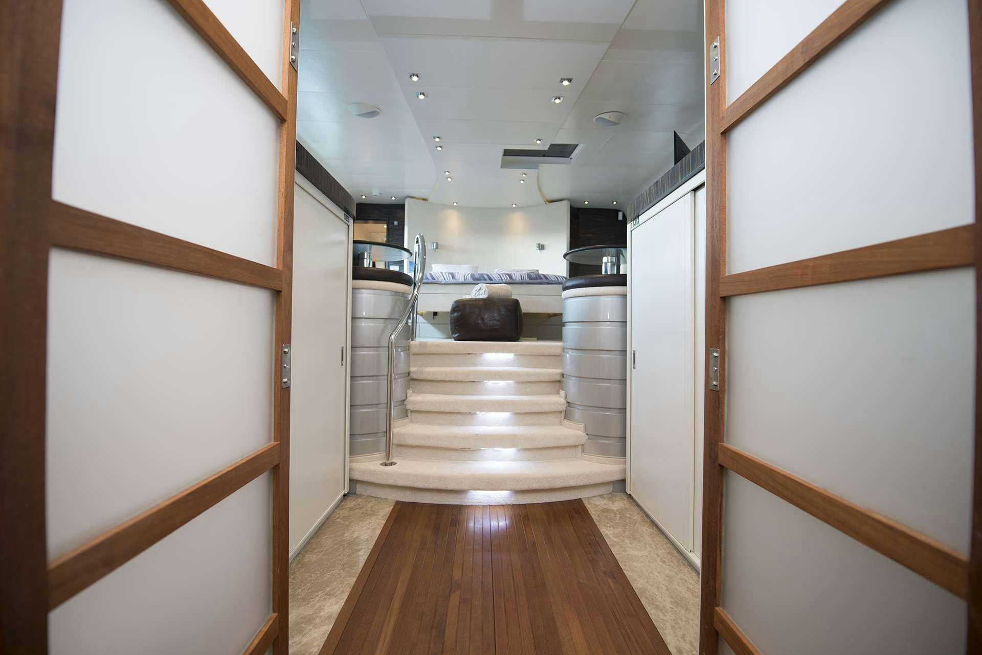 a long hallway with a wood floor aboard ONE BLUE Yacht for Charter