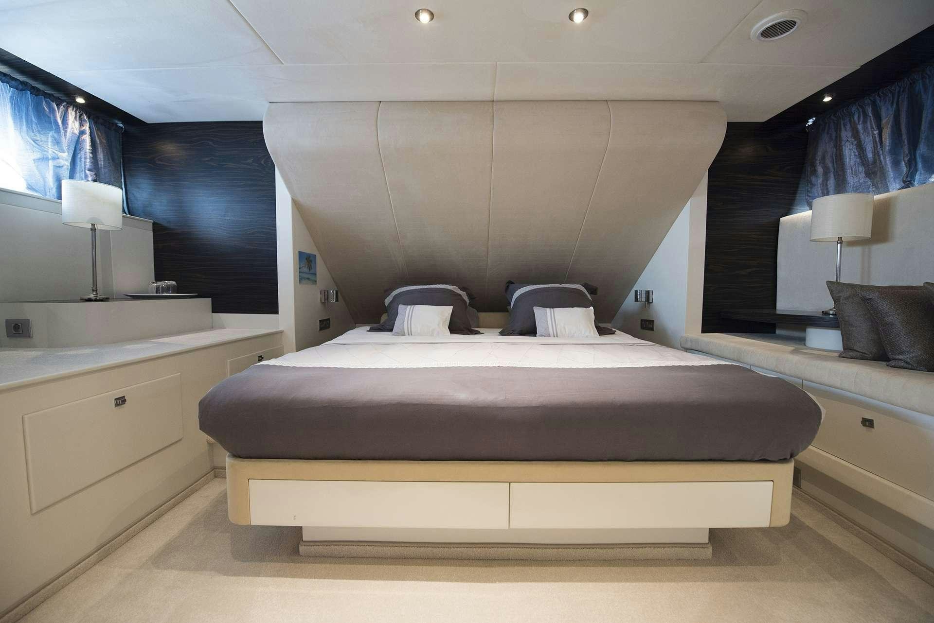 a bed in a room aboard ONE BLUE Yacht for Charter