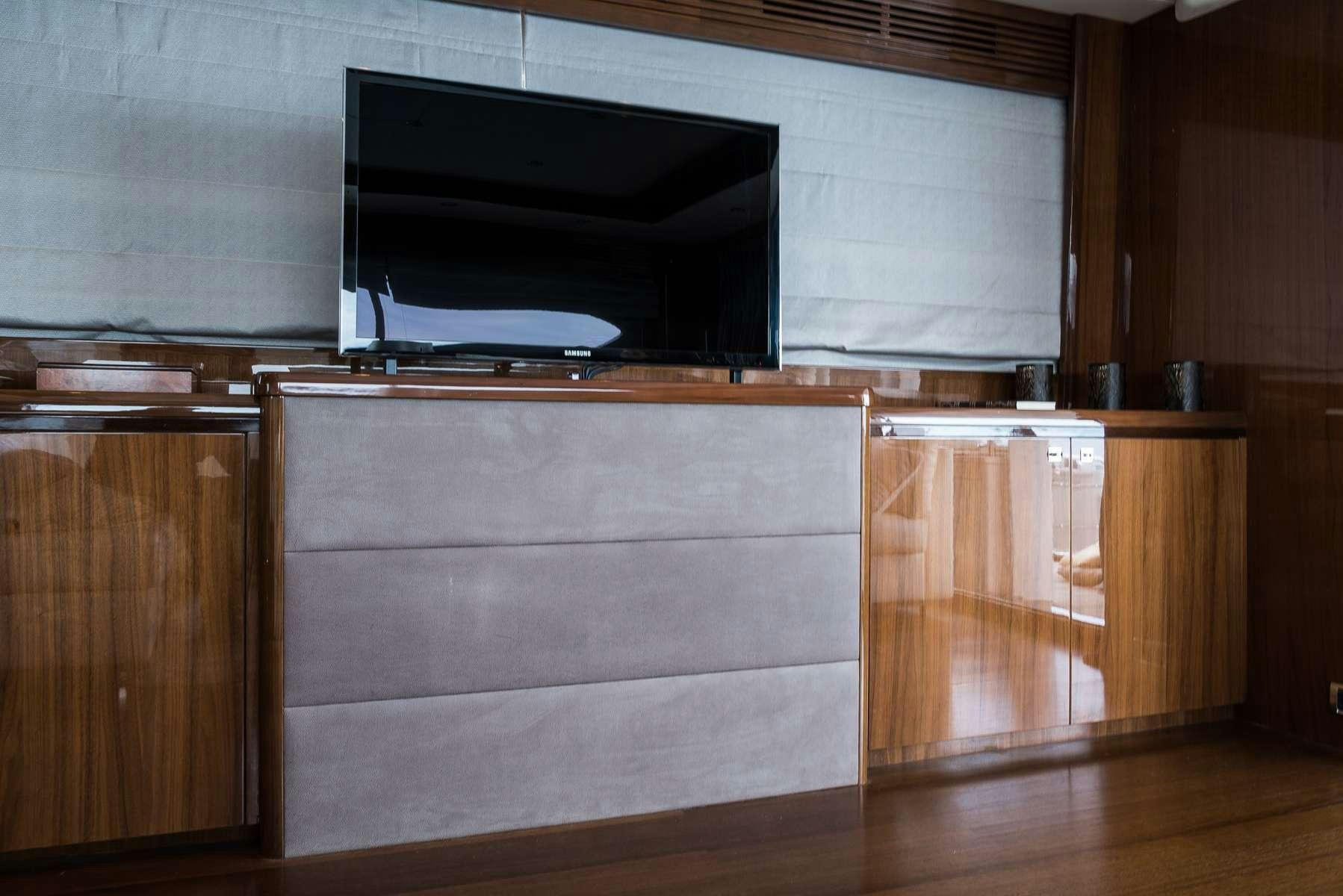 a kitchen with wooden cabinets aboard 4LIFE Yacht for Charter