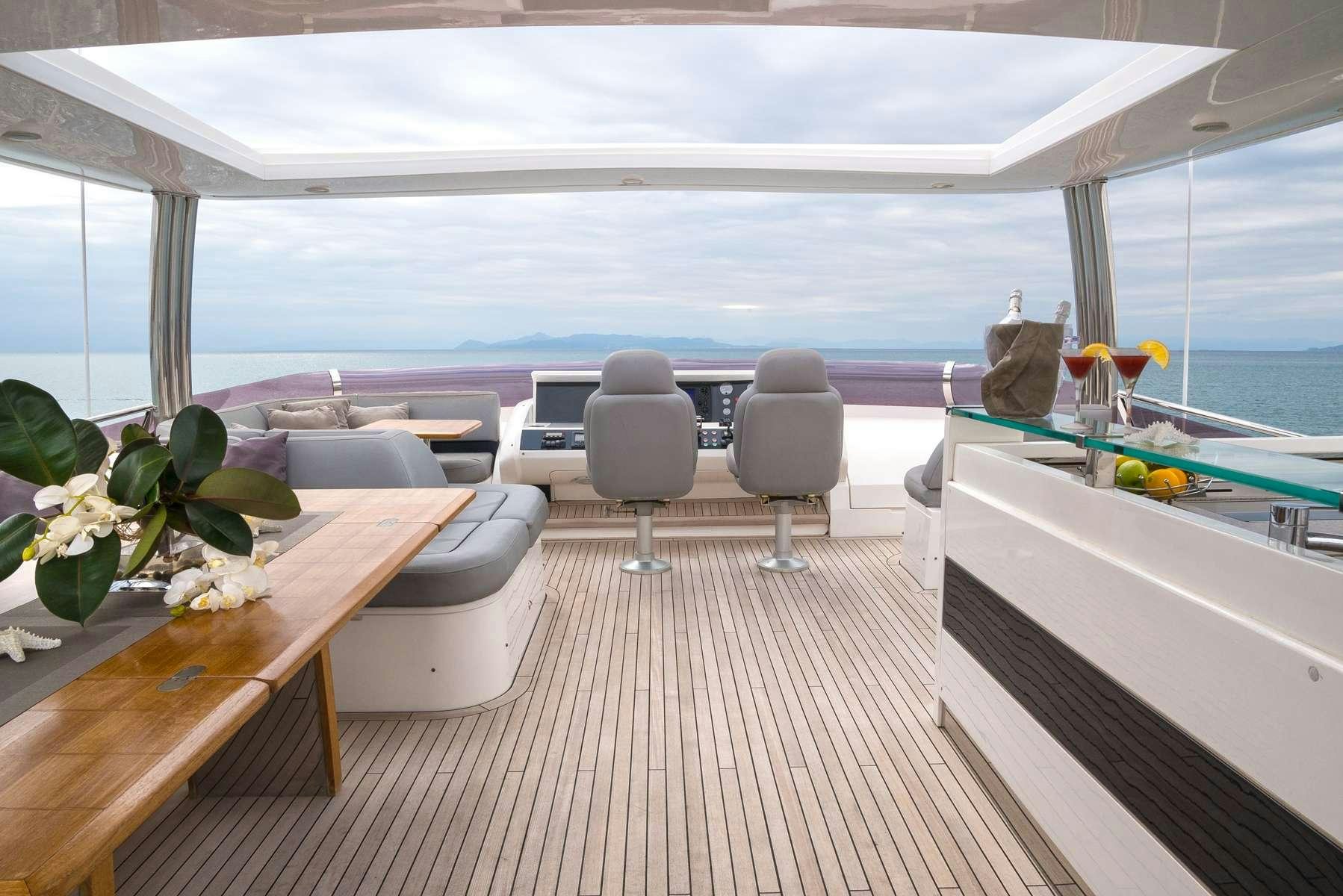 a room with a table and chairs aboard 4LIFE Yacht for Charter