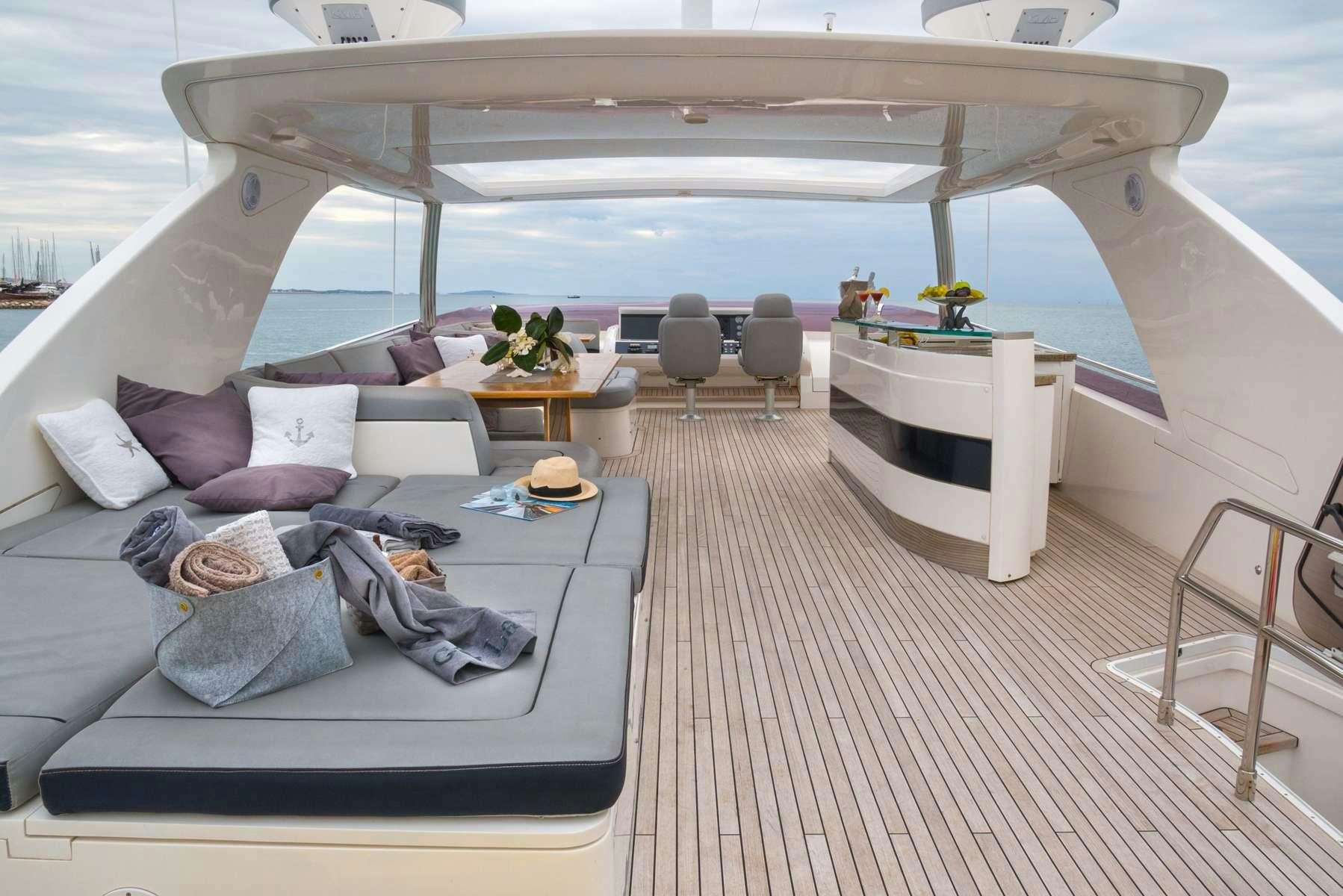 a person sleeping on a couch aboard 4LIFE Yacht for Charter