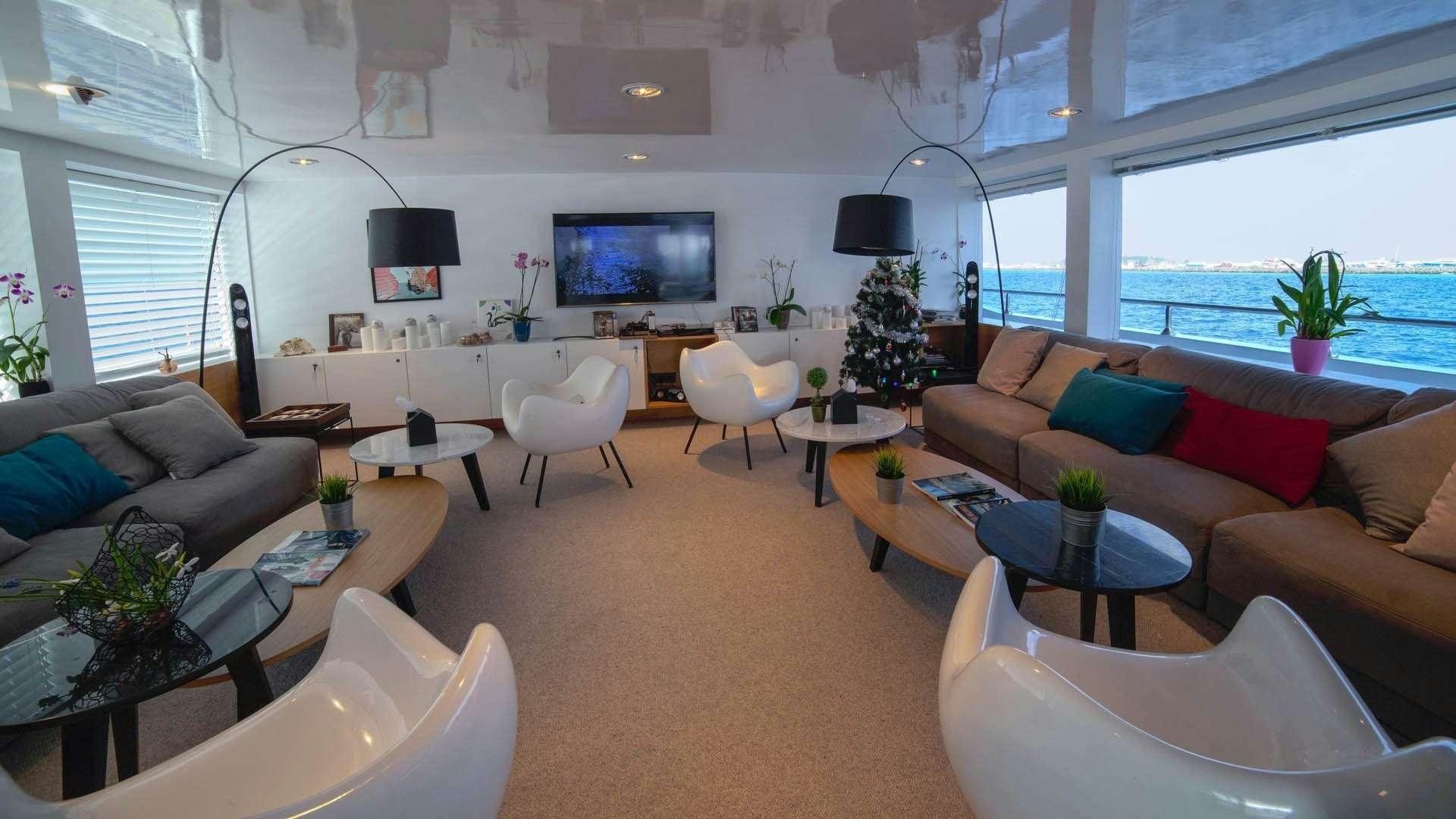 a living room with a large window aboard AZALEA Yacht for Charter