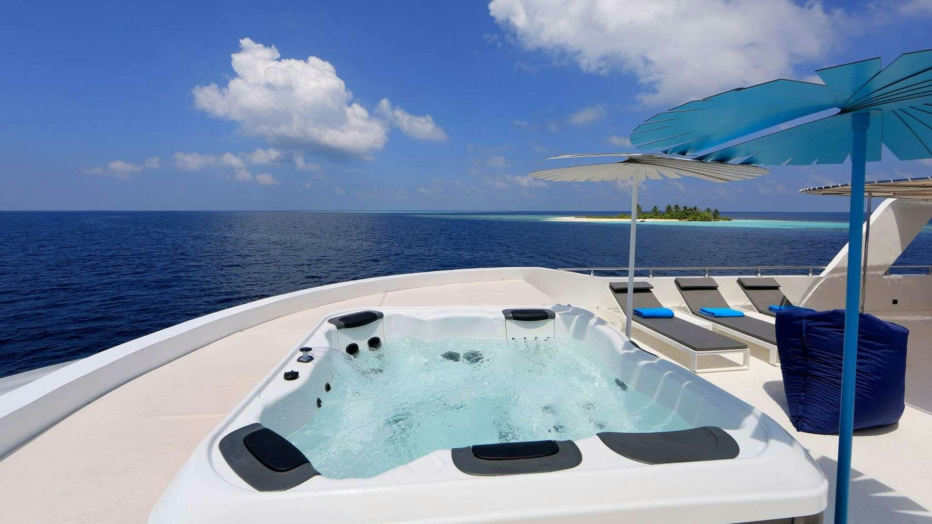 a white yacht on the water aboard AZALEA Yacht for Charter