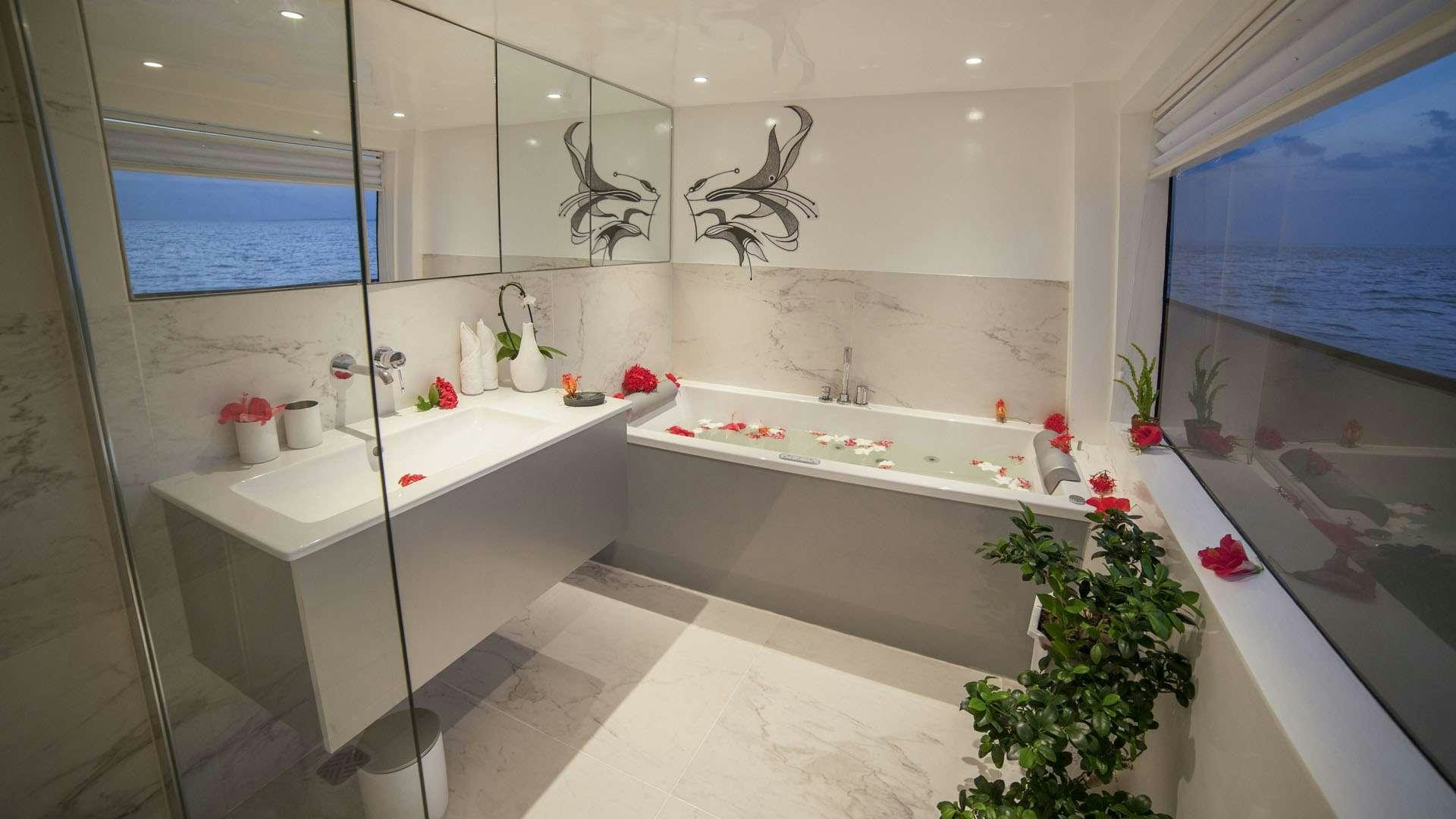a bathroom with a large tub aboard AZALEA Yacht for Charter