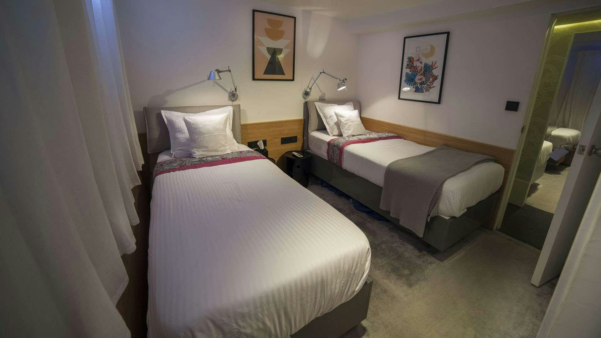a couple of beds in a room aboard AZALEA Yacht for Charter