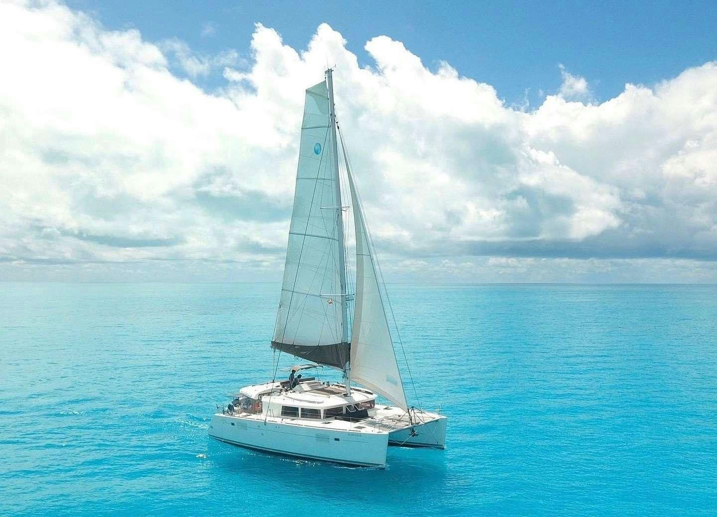 a sailboat in the water aboard Madrigal V Yacht for Charter