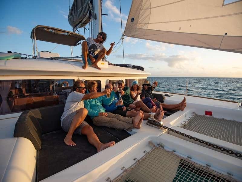 a group of people on a boat aboard Madrigal V Yacht for Charter