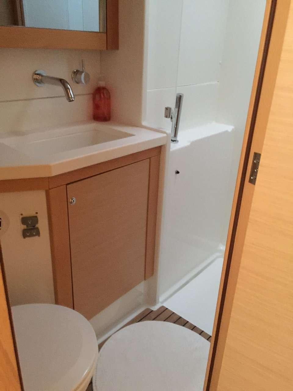 a bathroom with a sink and toilet aboard Madrigal V Yacht for Charter