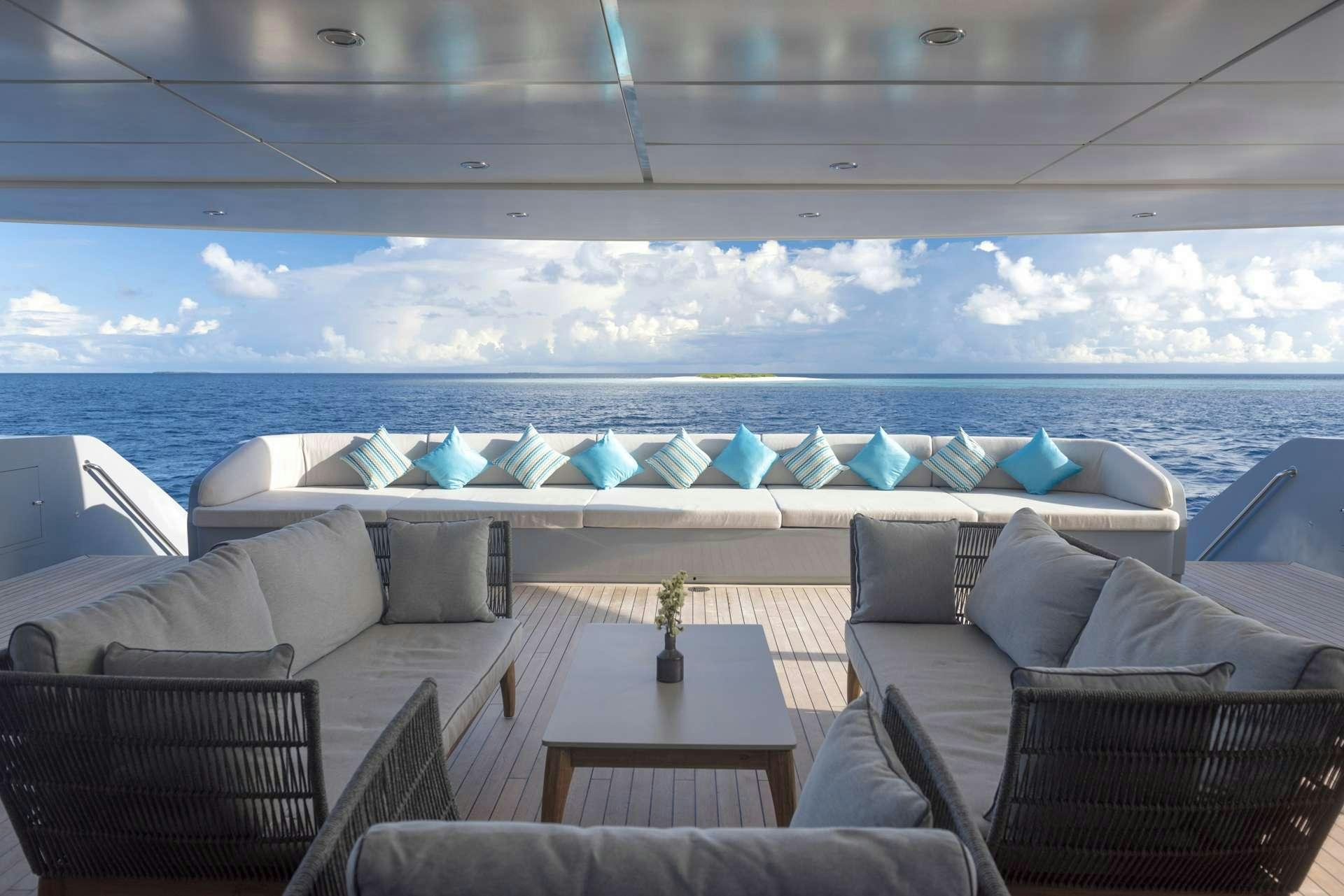 a room with a table and chairs aboard SEAREX Yacht for Charter