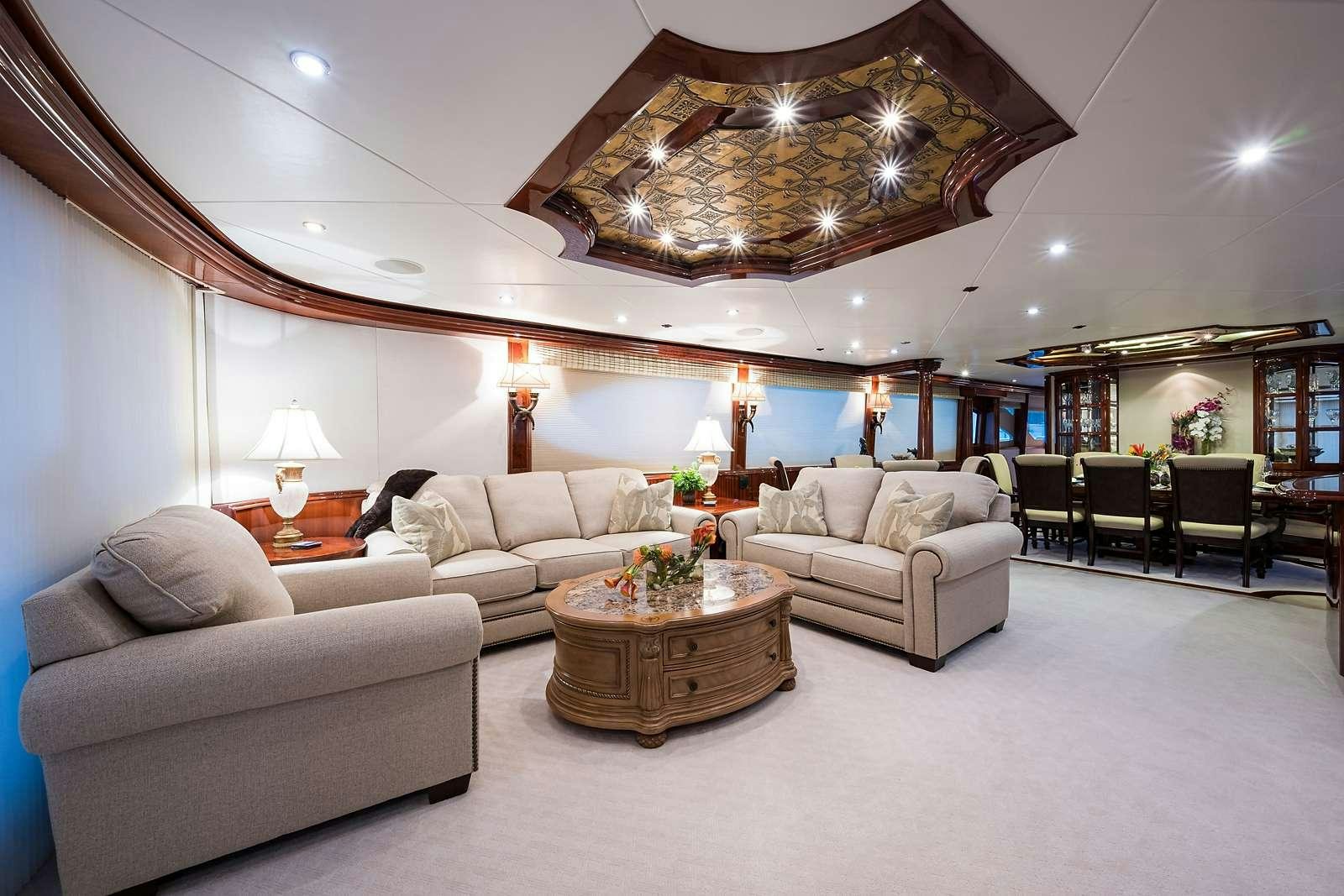 a living room with a large mirror aboard BELLA CONTESSA Yacht for Charter