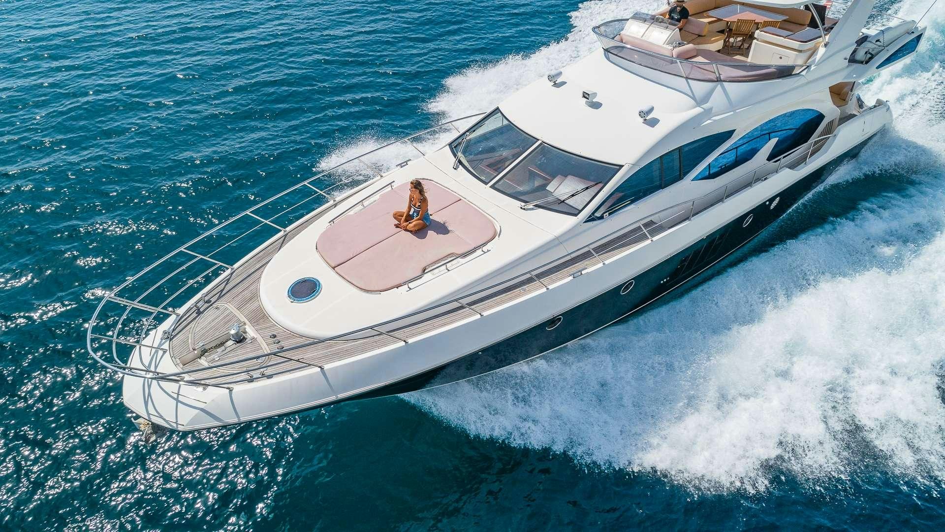 a white boat on the water aboard WICKED Yacht for Charter