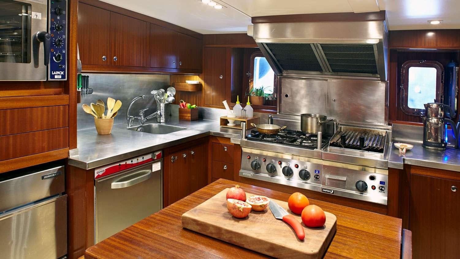 a kitchen with a stove and a sink aboard G GIRL Yacht for Charter