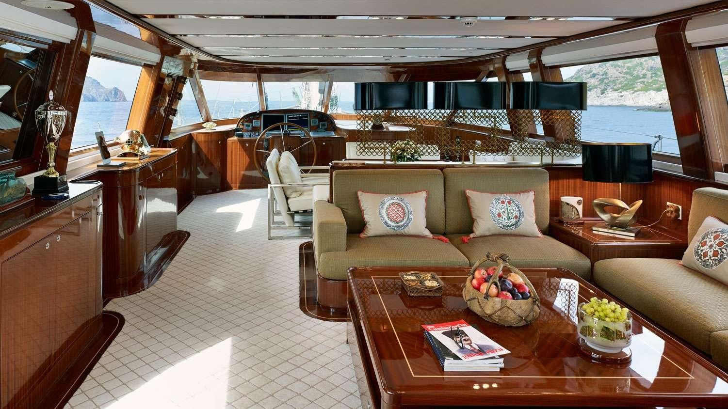 a living room with a large window aboard G GIRL Yacht for Charter