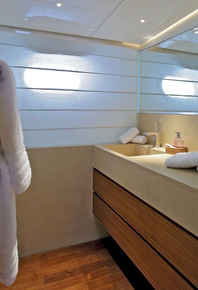 a bathroom with a large mirror aboard TROPICANA Yacht for Charter